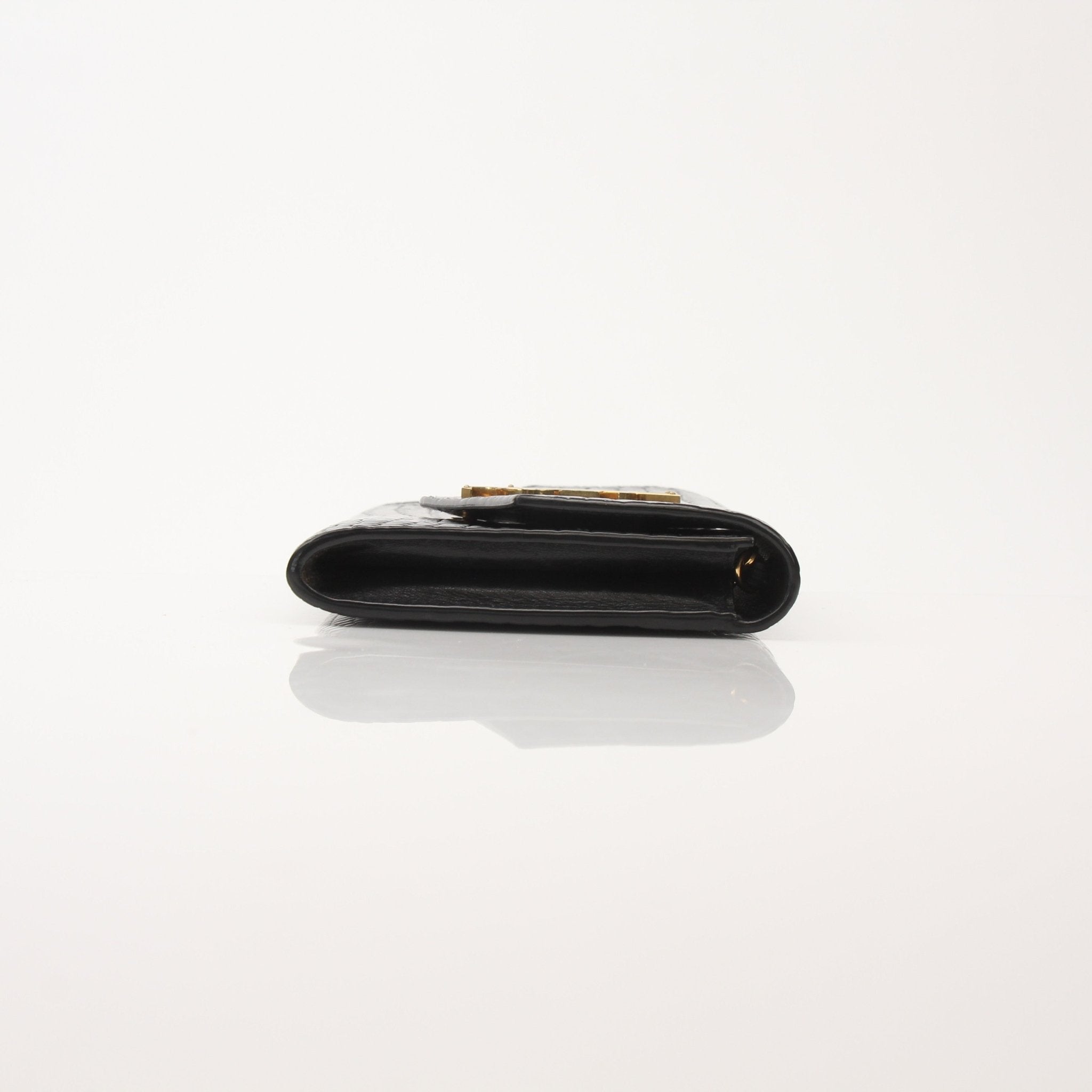 Saint Laurent Uptown Chain Wallet by Gold & Beyond, featuring a sleek design with a chain strap and luxurious leather finish.