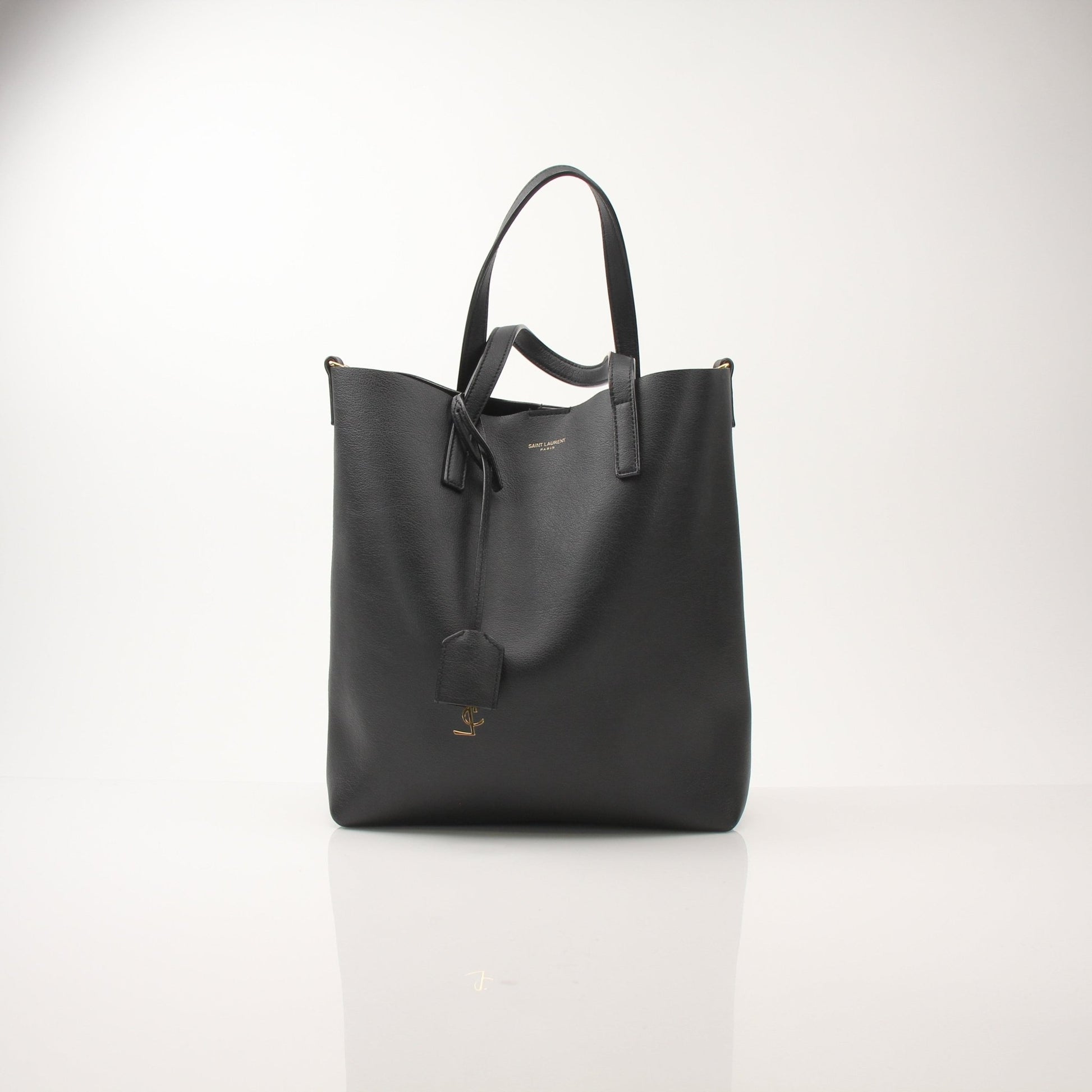 Gold & Beyond Saint Laurent Toy Shopping Tote handbag with black leather handles and gold-tone hardware.