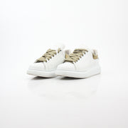 Alexander McQueen white gold oversized low-top sneakers with chunky design and bold style, featuring white and gold details.