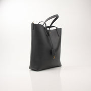 Gold & Beyond Saint Laurent Toy Shopping Tote handbag with beige and black color block design, featuring sturdy handles and logo details.