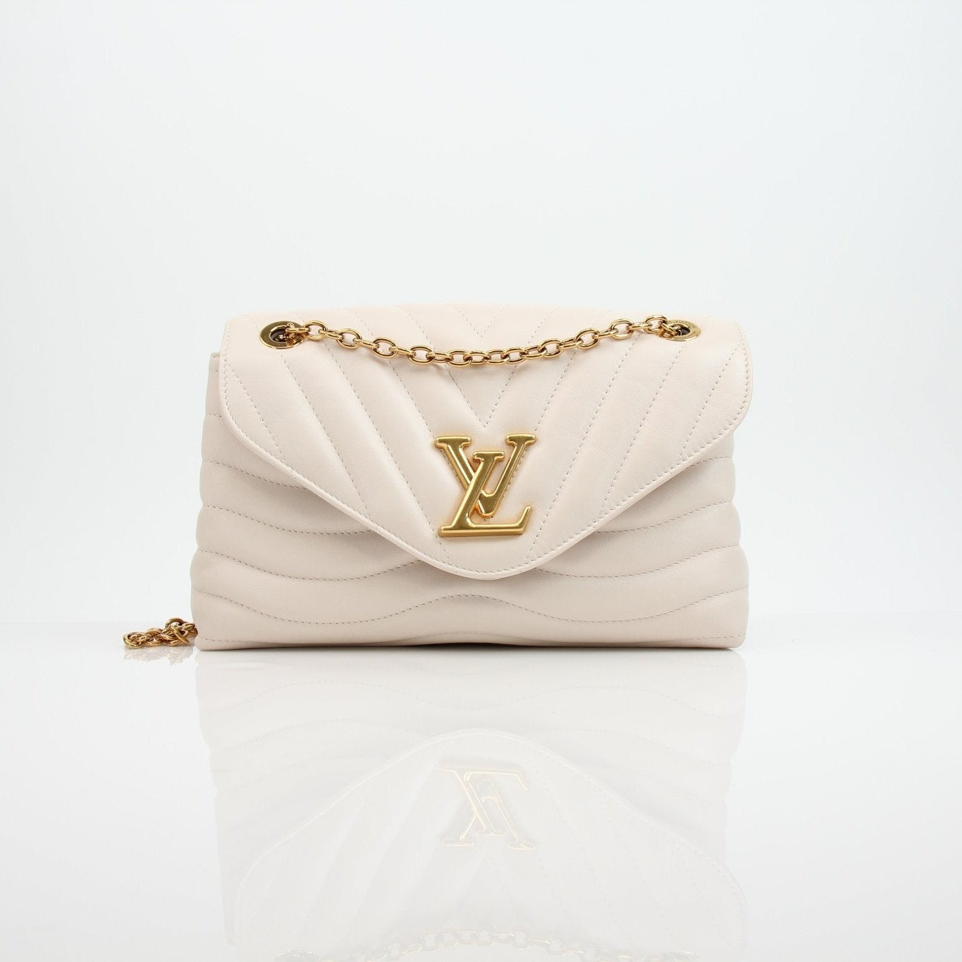 Louis Vuitton New Wave cream chain handbag with gold accents, featuring a sleek design and stylish shoulder strap.