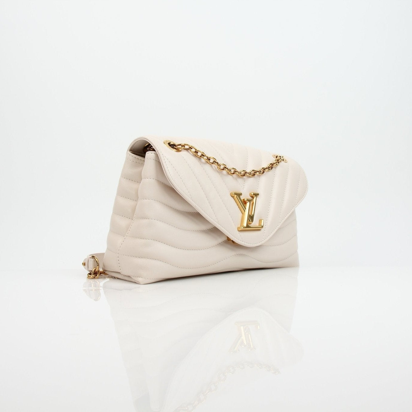 Louis Vuitton New Wave cream chain handbag by Gold & Beyond, featuring a stylish design and gold chain strap.