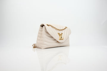 Louis Vuitton New Wave Chain Bag in cream calfskin featuring elegant gold hardware and a stylish chain strap.