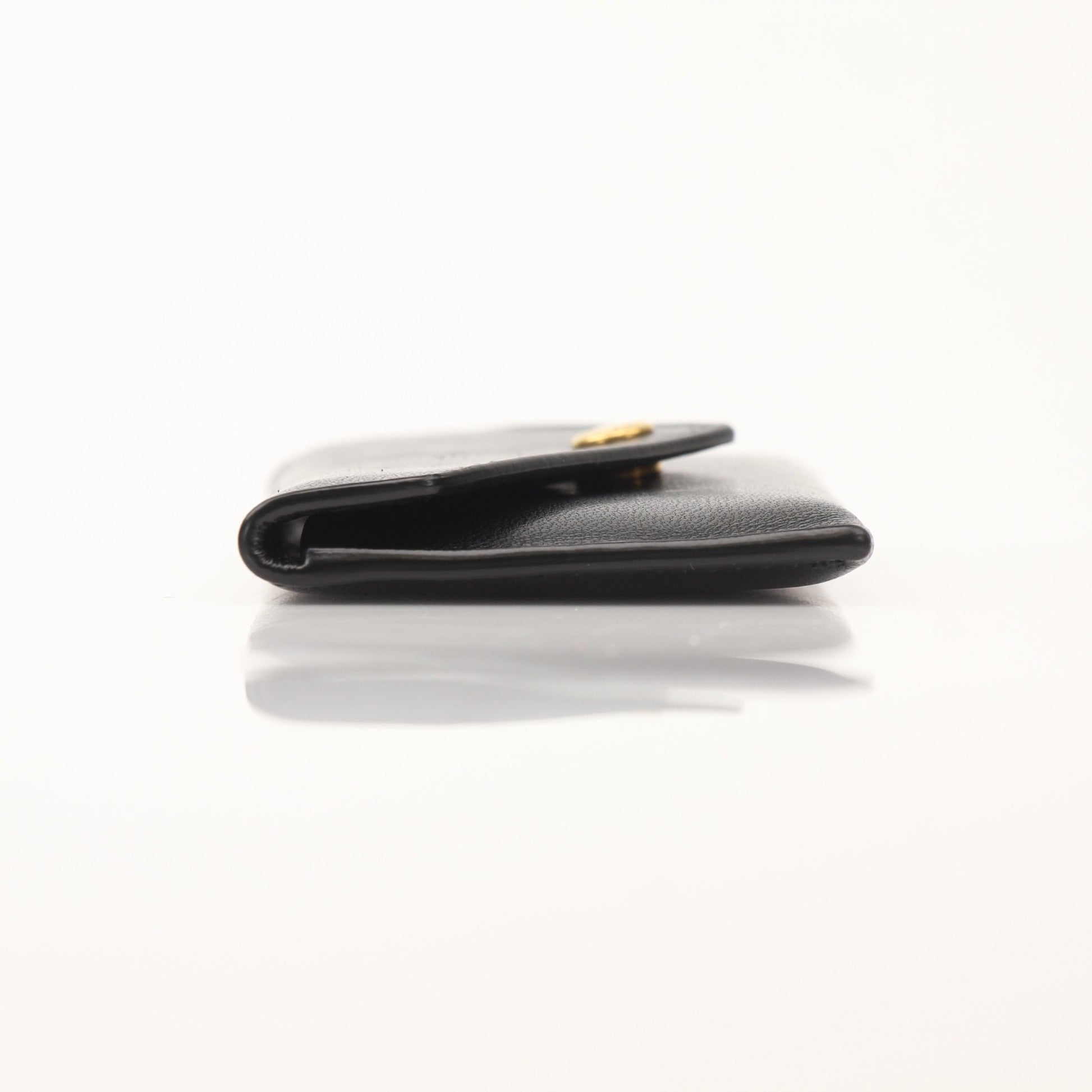 Saint Laurent Loulou lambskin card holder with gold hardware and multiple card slots, black leather, in a sleek, compact design.