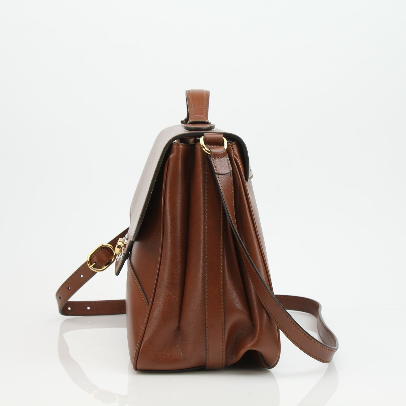 Gold & Beyond Gucci Pienza brown leather handbag with adjustable shoulder strap and gold-tone hardware, stylish messenger bag.