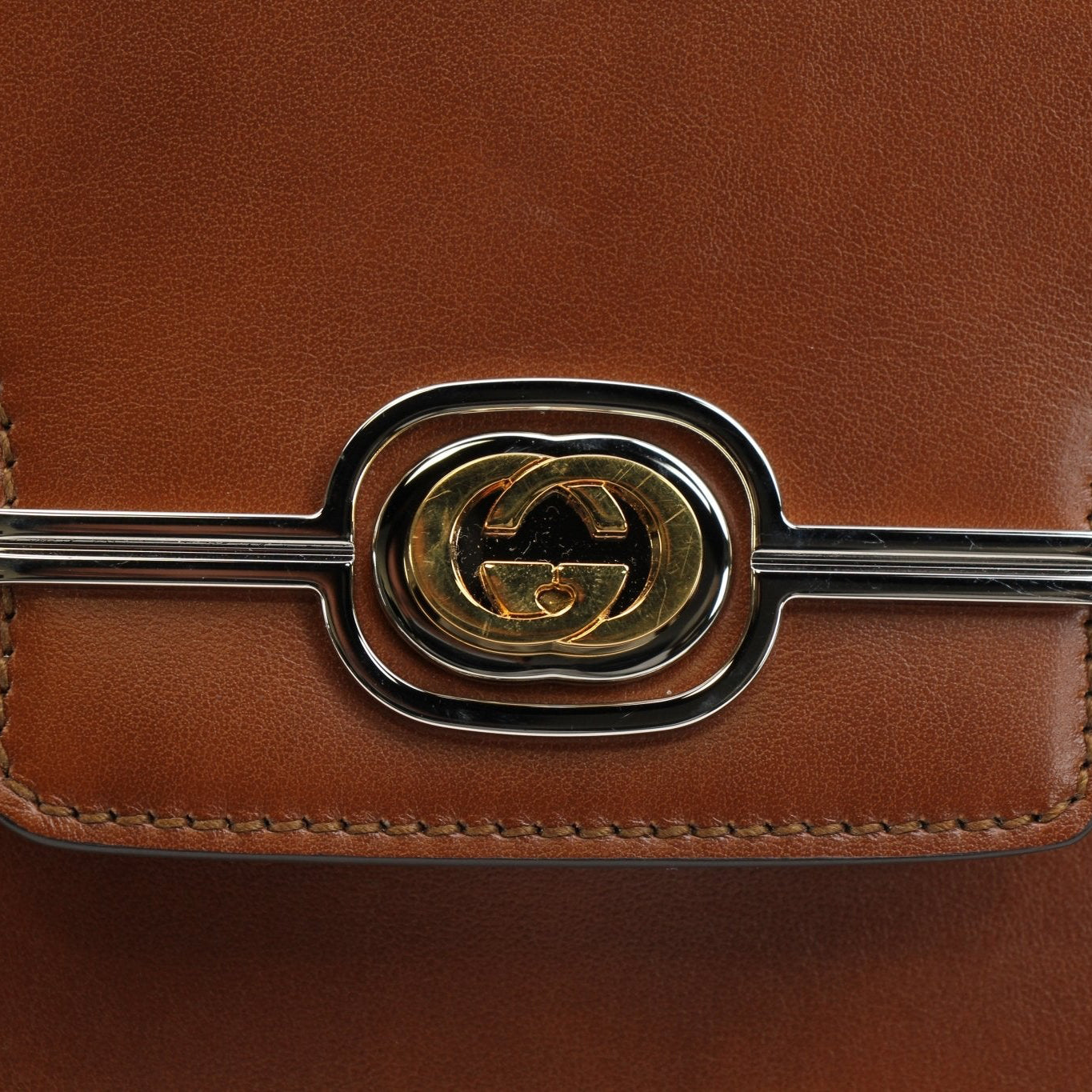 Gucci Pienza brown leather messenger handbag with gold-tone hardware and adjustable strap, stylish and versatile for everyday use.