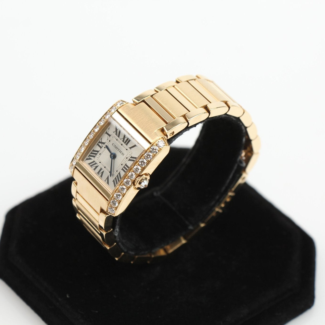 Cartier Tank Française diamond watch with gold bracelet and elegant rectangular face, showcasing luxury and sophisticated design.
