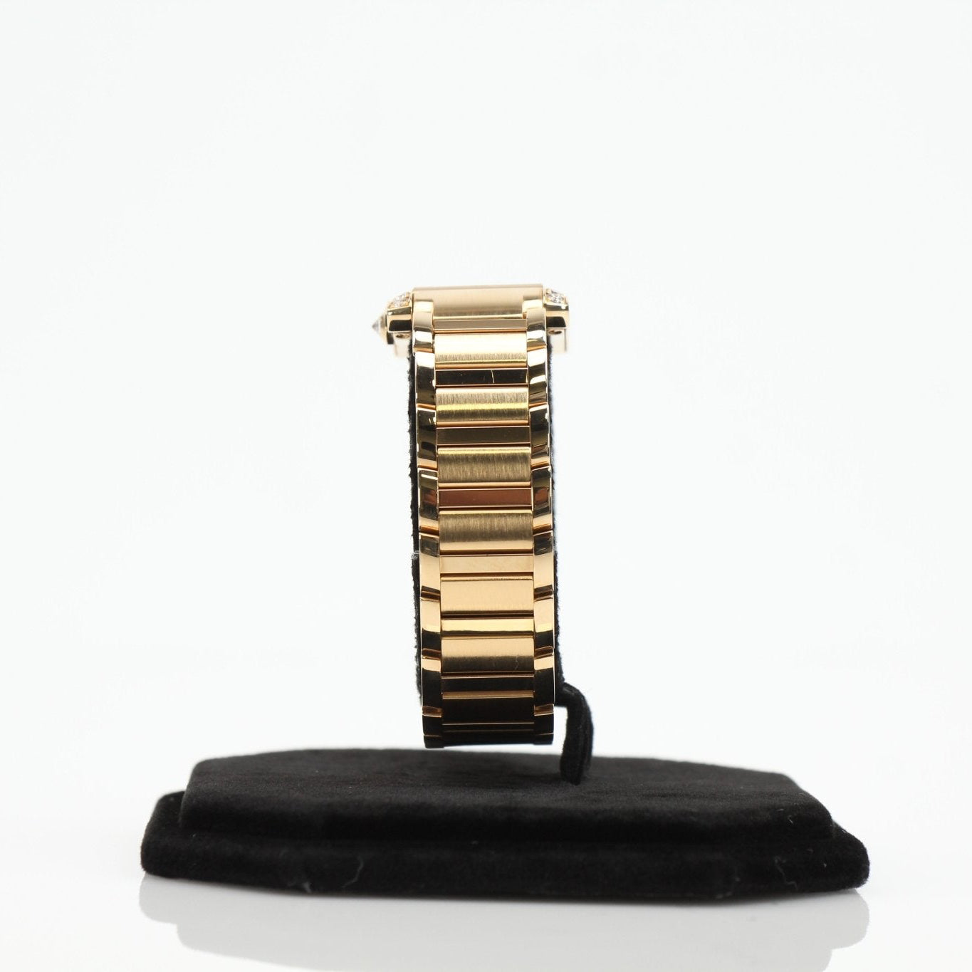Cartier Tank Française diamond watch with gold bracelet and rectangular face, featuring diamond accents and elegant design.