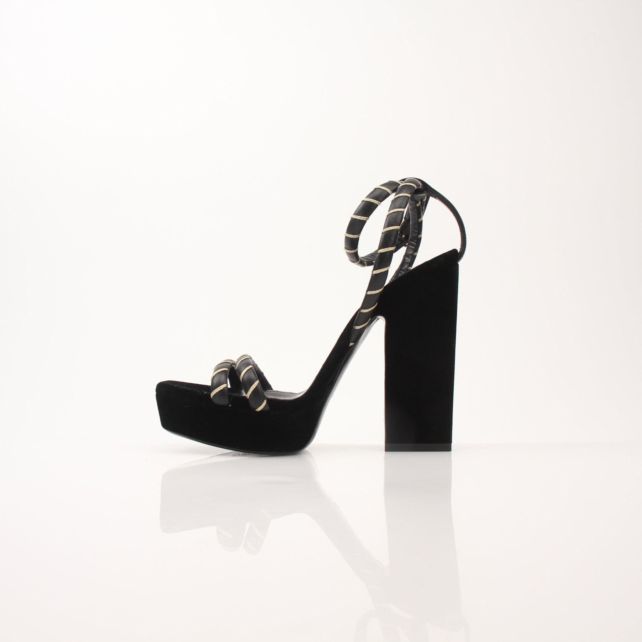 Gold & Beyond Saint Laurent Debbie ankle strap platform heels for women, showcasing stylish black leather sandals with high heels.