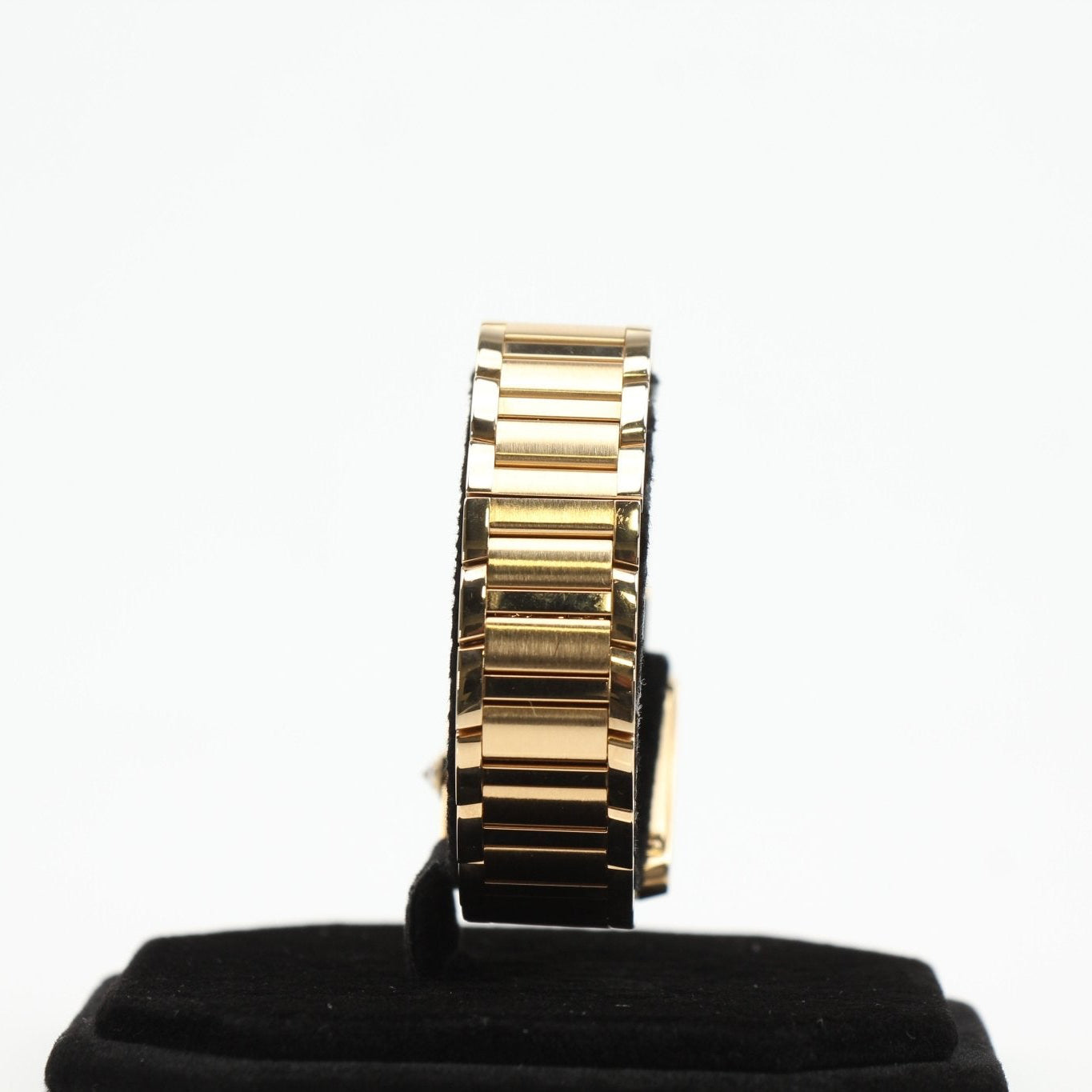 Cartier Tank Française diamond watch with gold bracelet and rectangular face, featuring diamond accents and a sleek design.