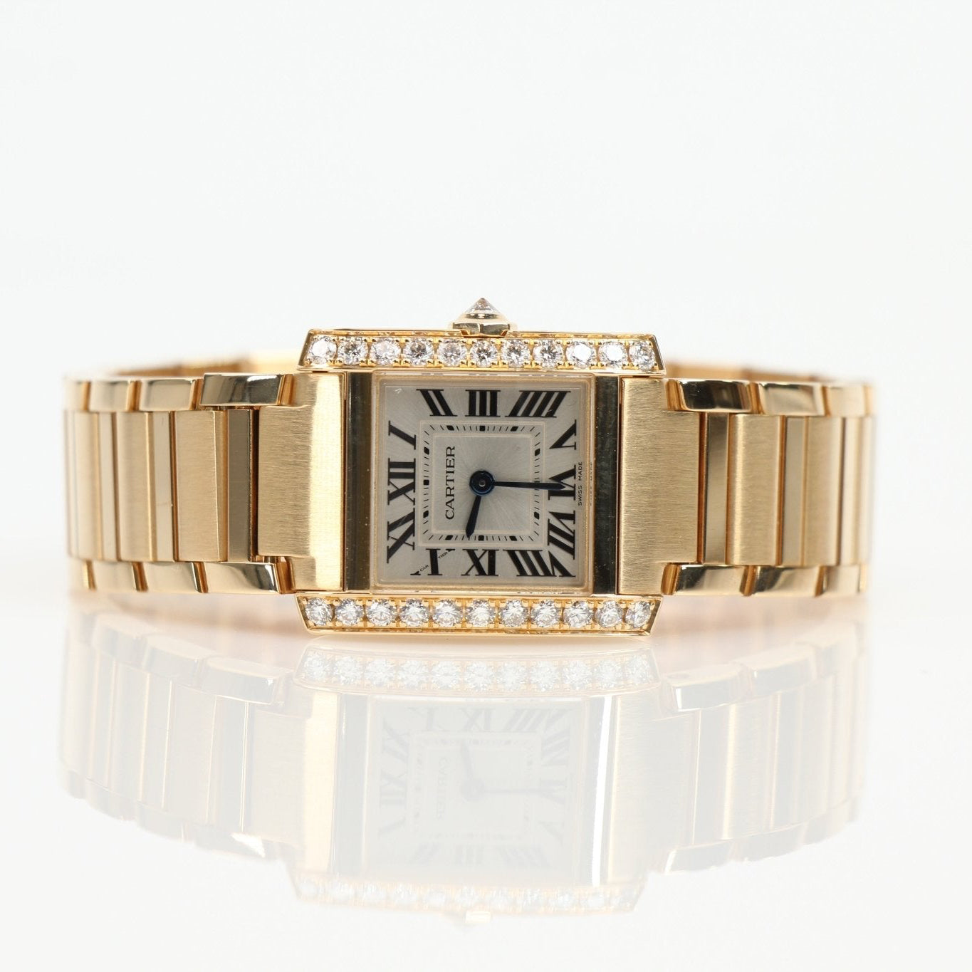 Cartier Tank Française diamond watch with gold bracelet and rectangular dial, showcasing elegant luxury and precise craftsmanship.