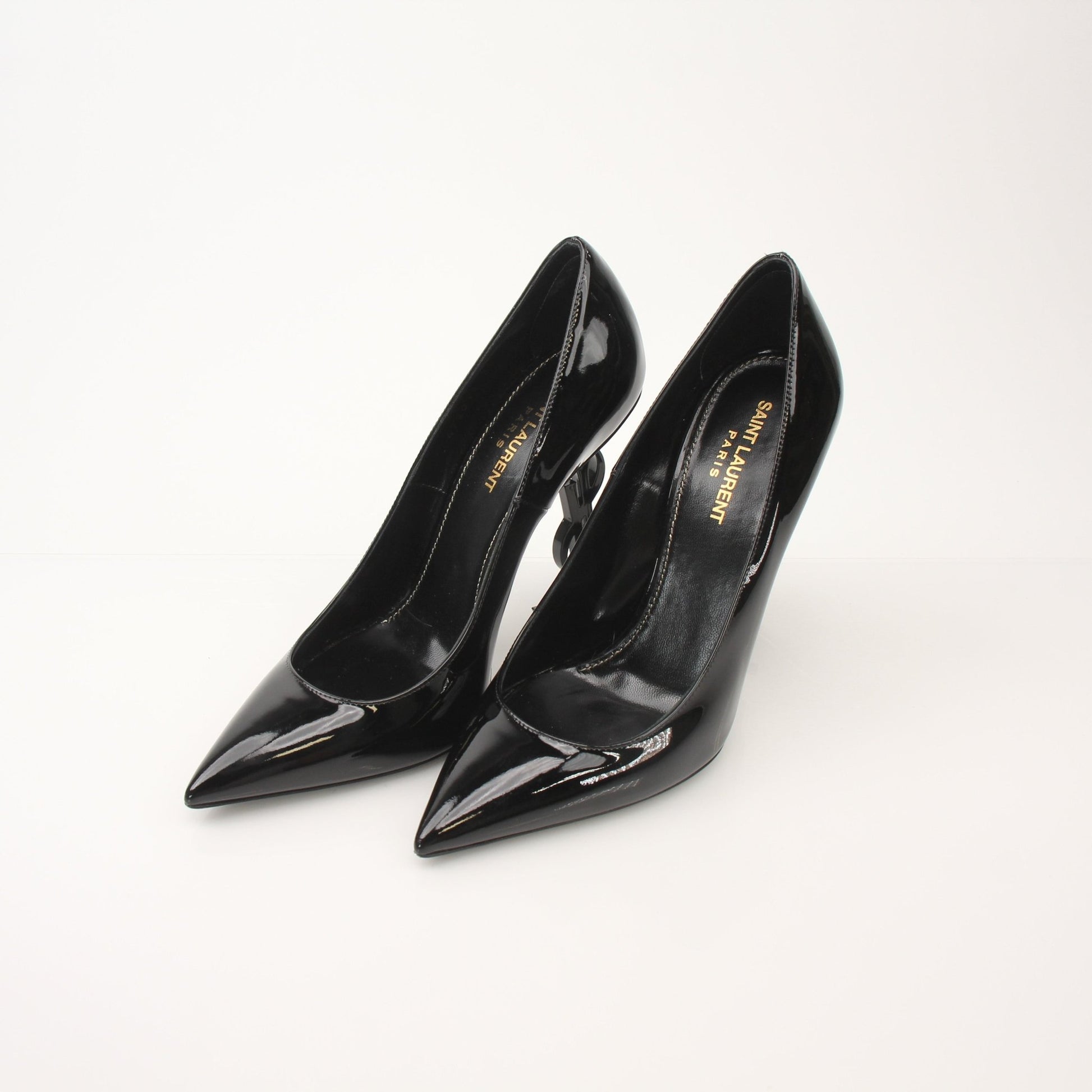 Gold & Beyond Saint Laurent Women’s Opyum 110 Pumps heels with sleek design and pointed toe, showcased on a neutral background.