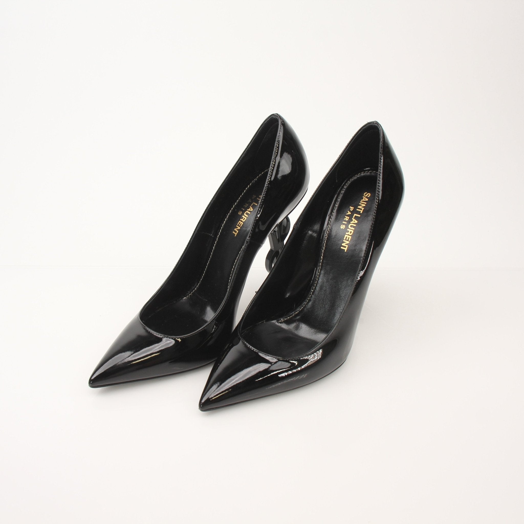 Gold & Beyond Saint Laurent Women’s Opyum 110 Pumps heels with sleek design and pointed toe, showcased on a neutral background.