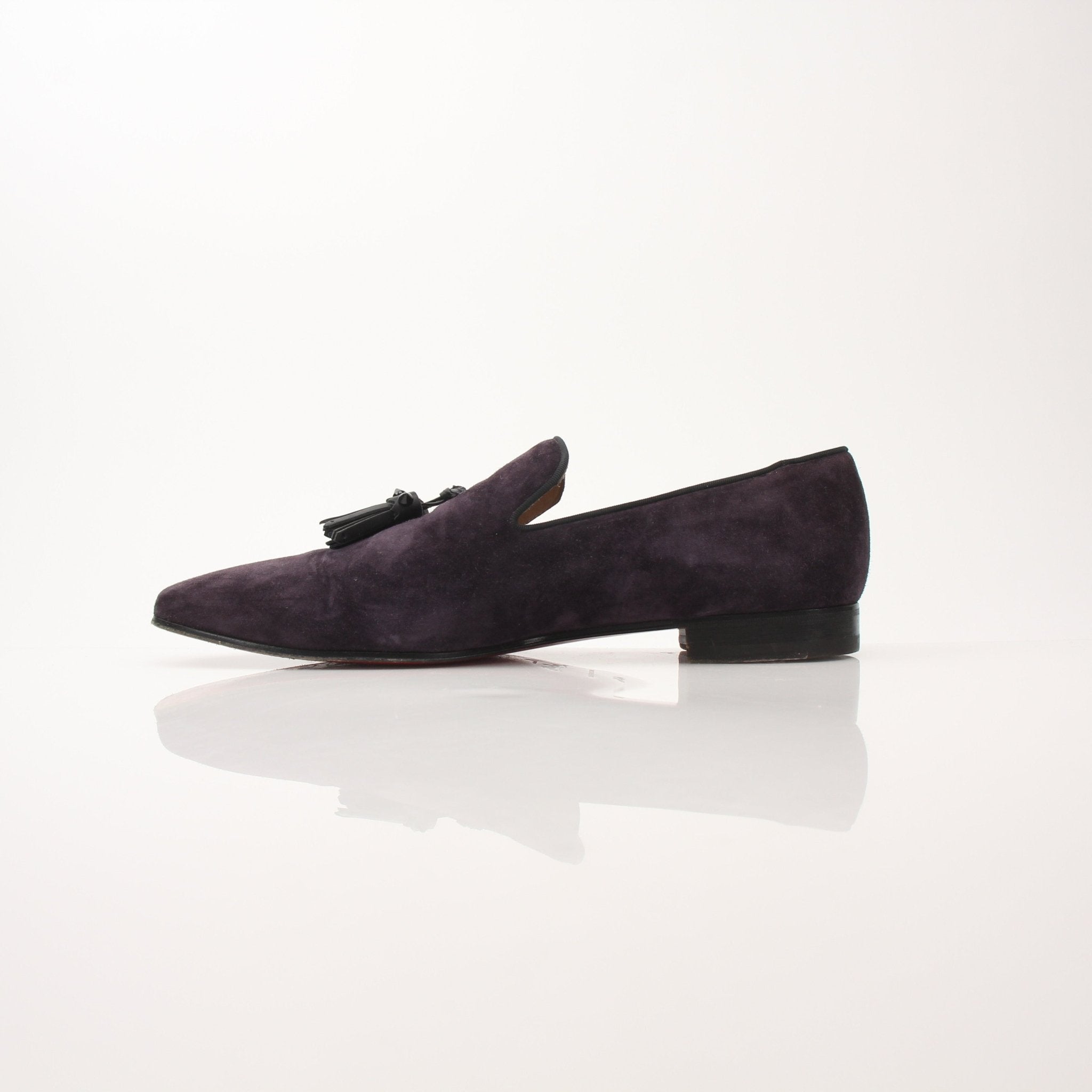 Christian Louboutin Men’s Dandelion Tassel Loafers in black leather with tassel details and signature red sole, stylish men's shoes.