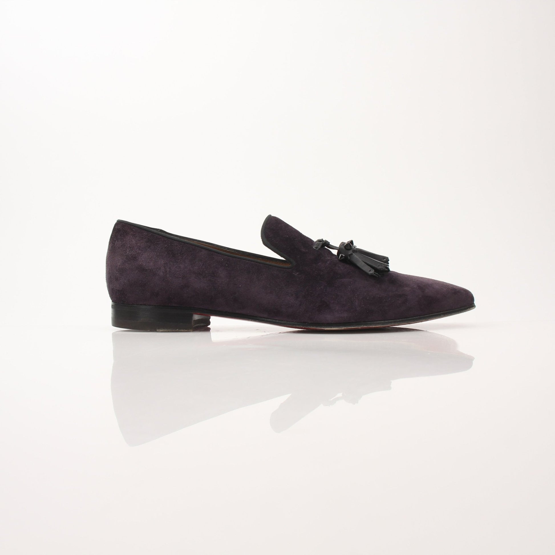 Christian Louboutin Men’s Dandelion Tassel Loafers, stylish black shoes with tassel details, featuring signature red soles and elegant design.