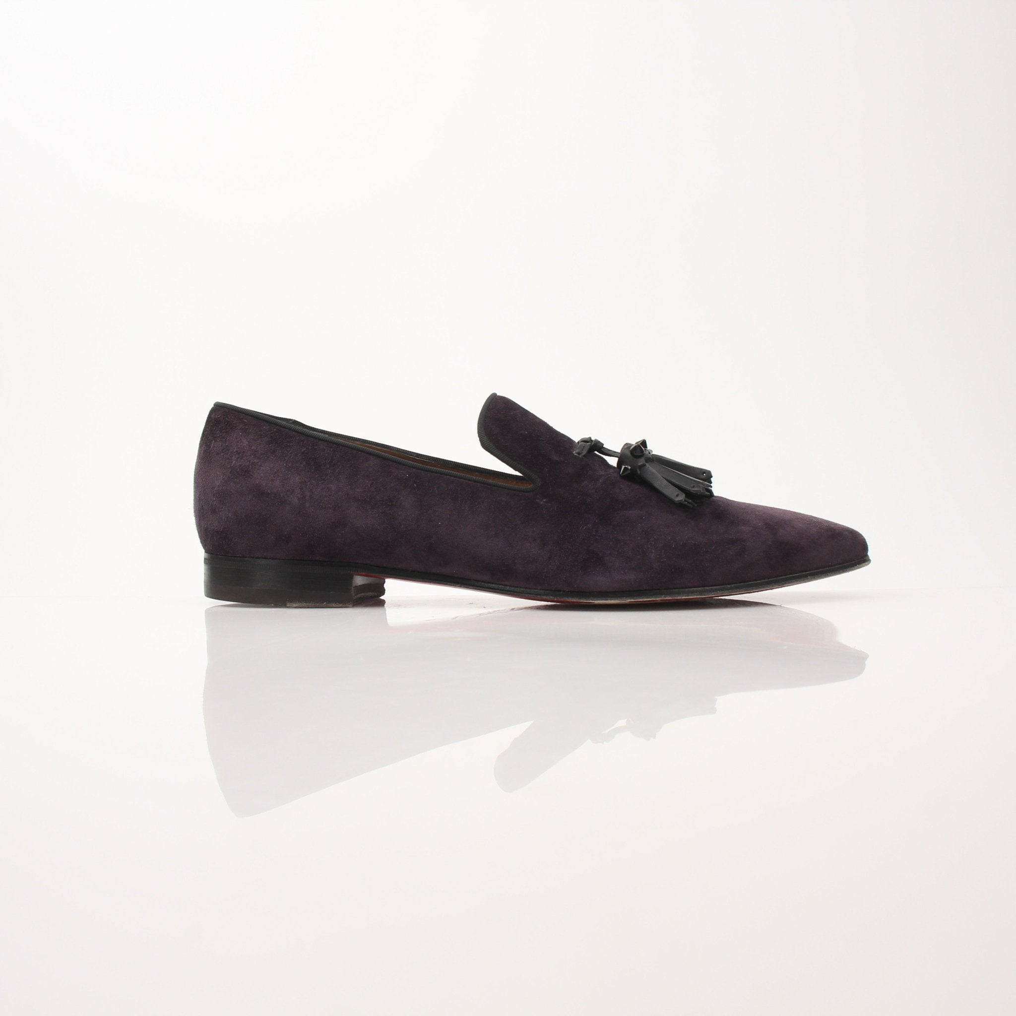 Christian Louboutin Men’s Dandelion Tassel Loafers, stylish black shoes with tassel details, featuring signature red soles and elegant design.
