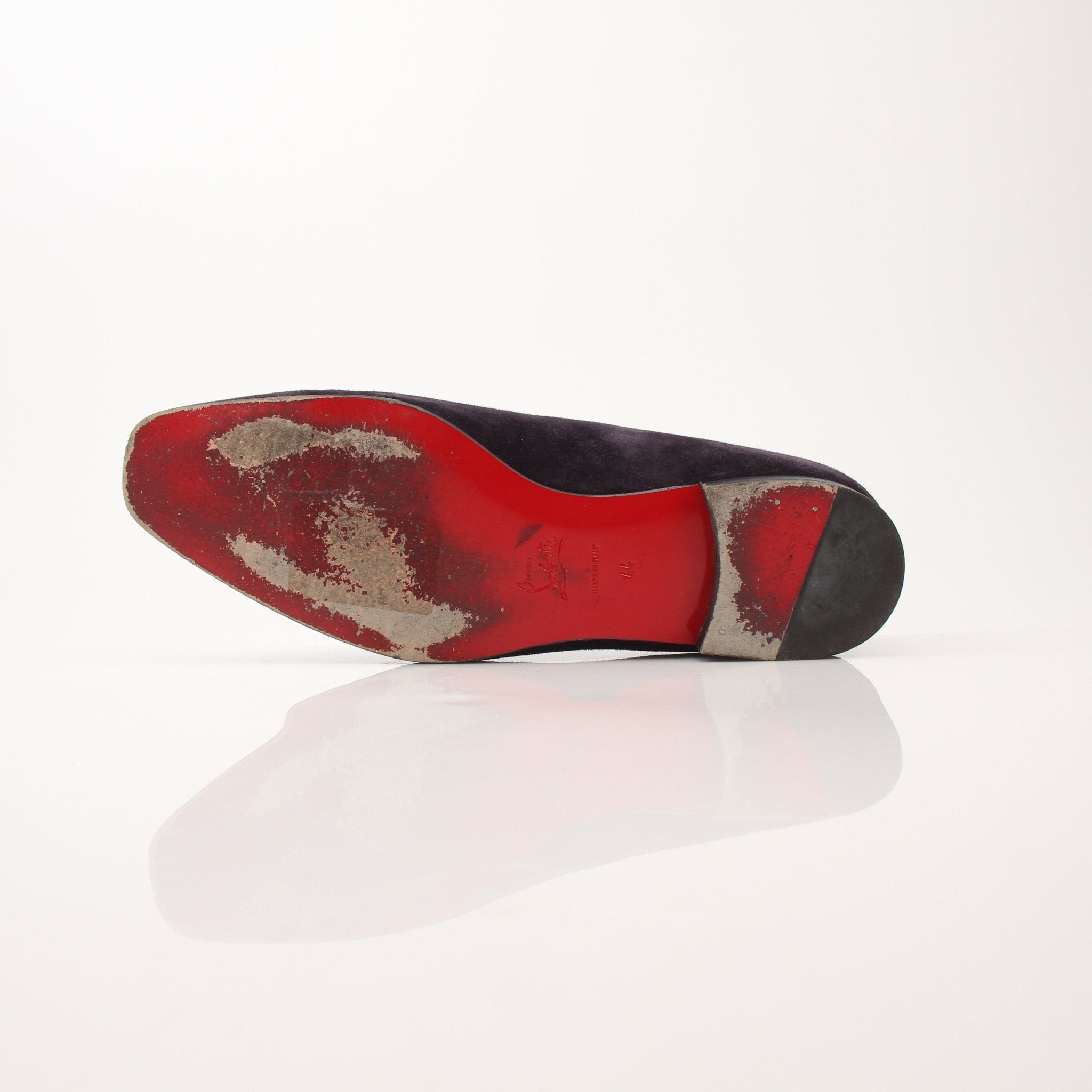 Christian Louboutin men’s Dandelion tassel loafers in black leather with signature red sole and decorative tassels.