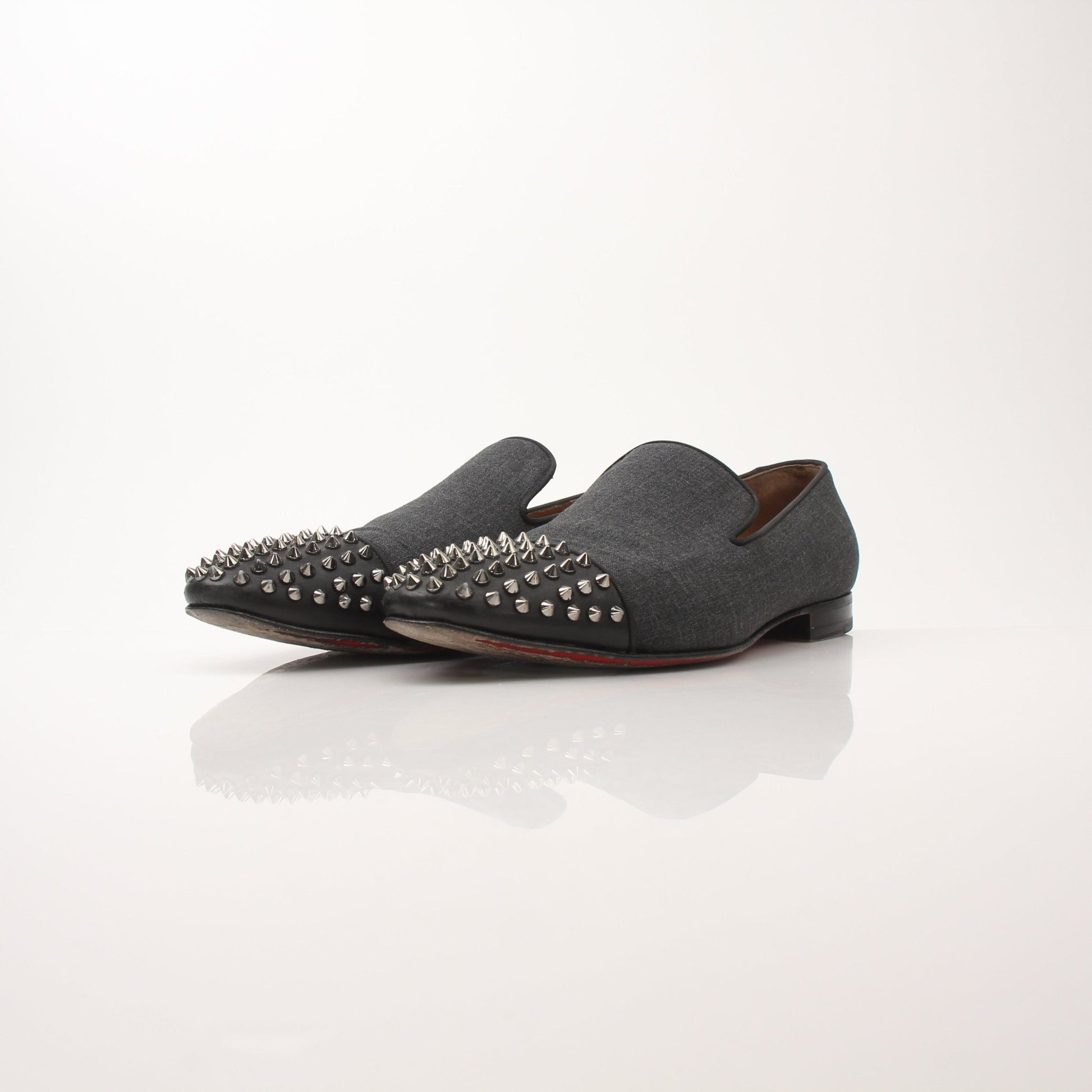 Christian Louboutin men's Spooky Spike flat loafers with black leather and spike embellishments, stylish men's shoes from Gold & Beyond.