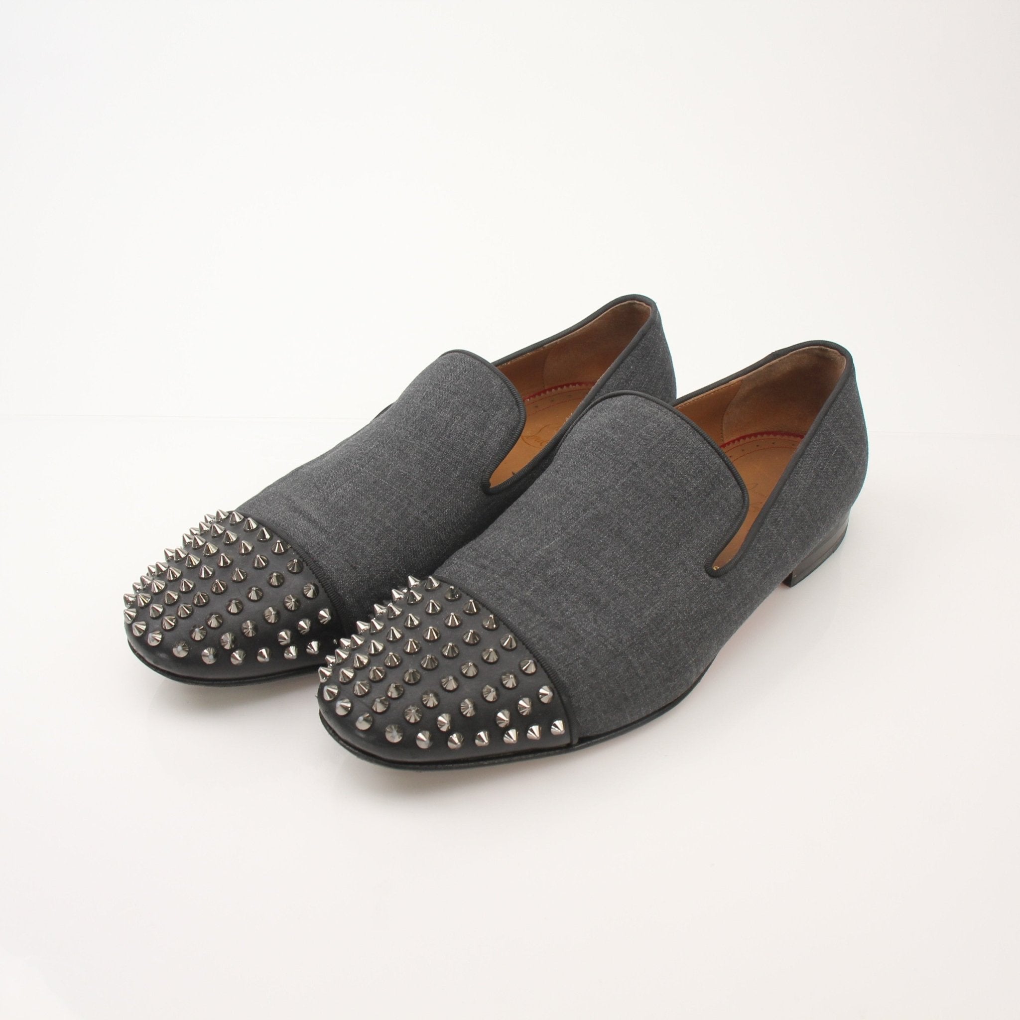 Christian Louboutin men's Spooky Spike flat loafers with black leather and distinctive spike details.