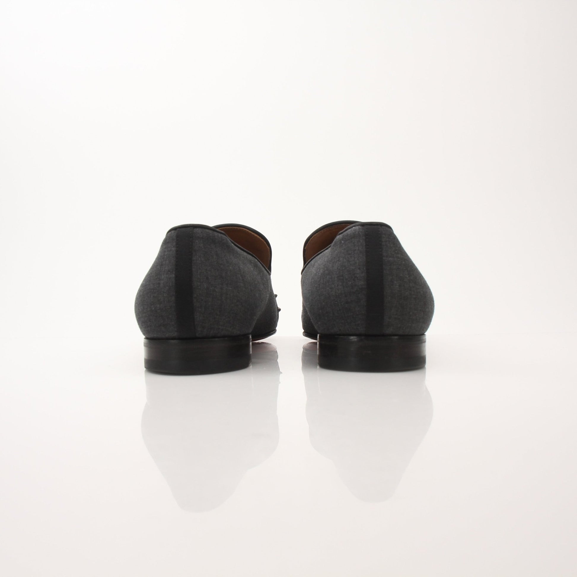 Christian Louboutin men's Spooky Spike flat loafers with black leather and distinctive spike detailing.