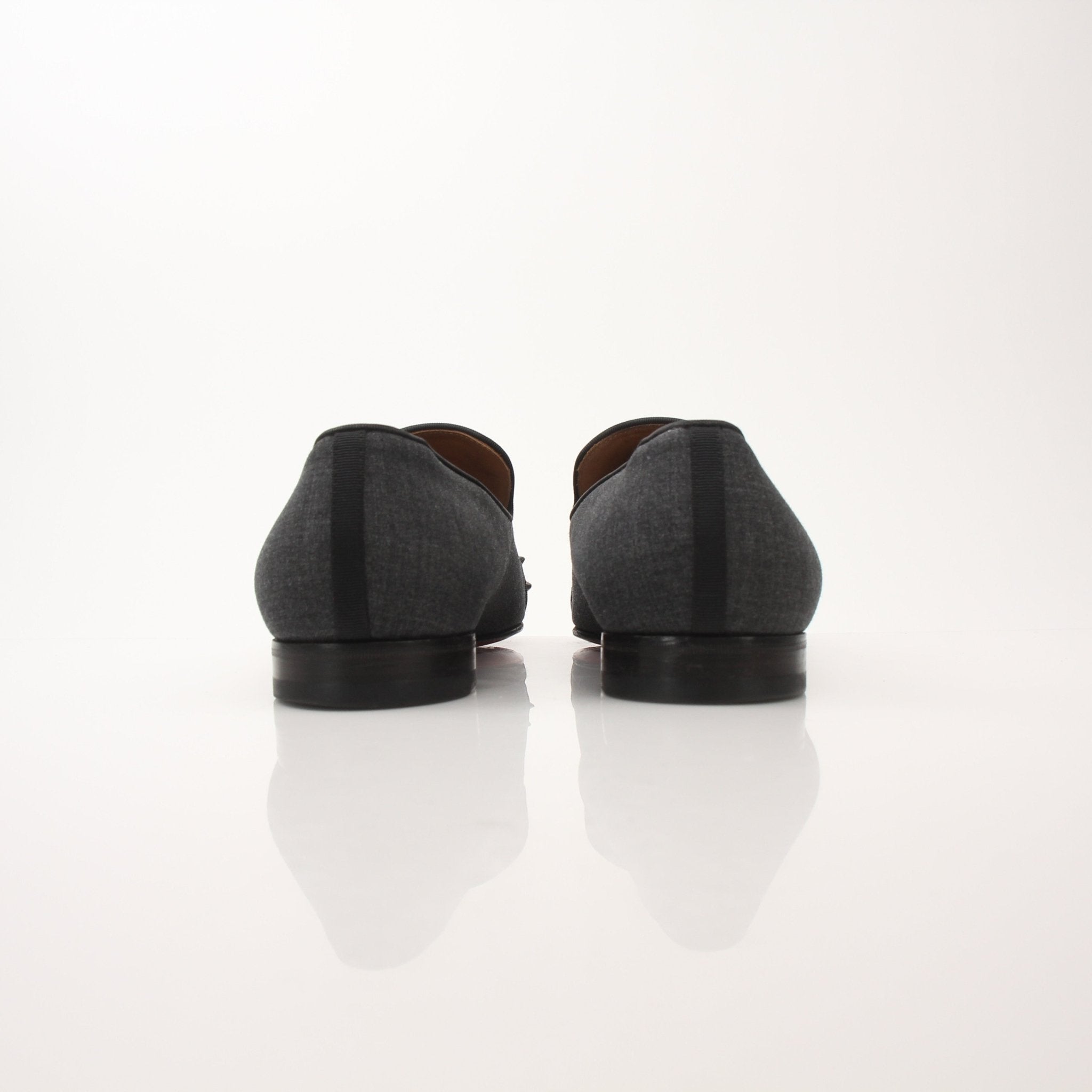 Christian Louboutin men's Spooky Spike flat loafers with black leather and distinctive spike detailing.