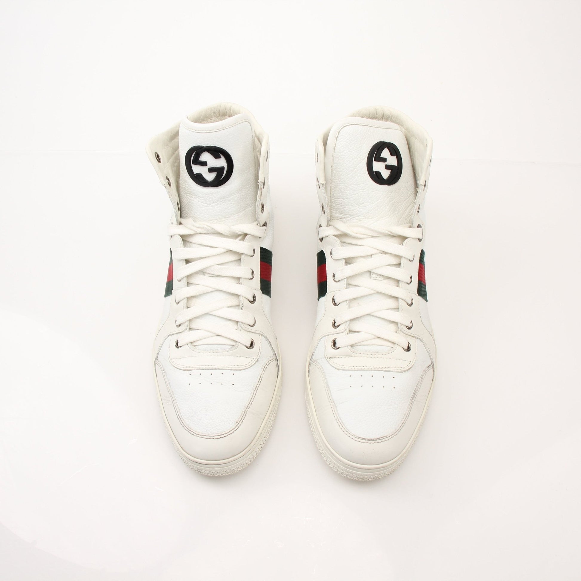 Gold & Beyond Gucci men's signature high-top sneakers with white laces and logo details, stylish shoes for men.