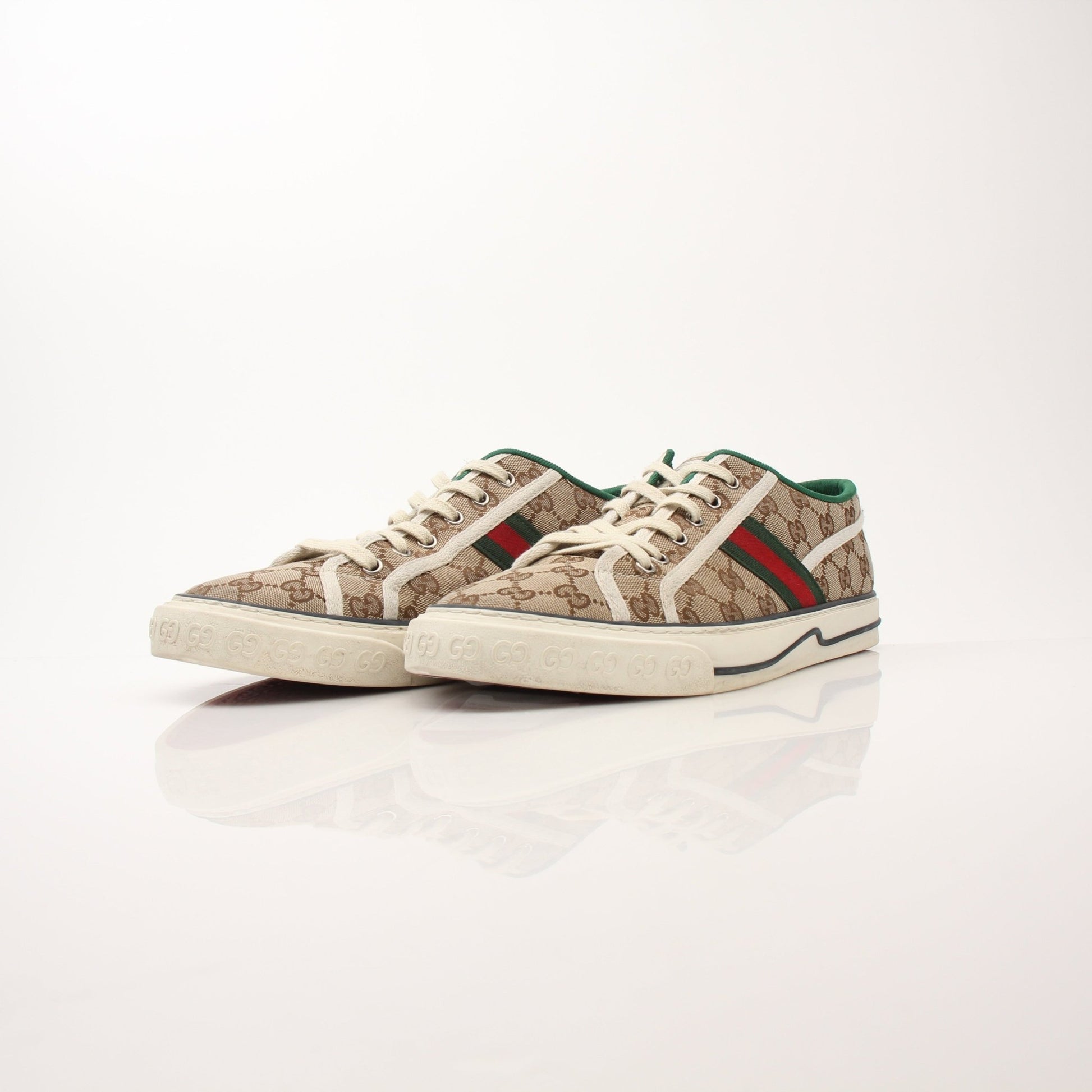 Gold & Beyond men's Gucci GG Tennis 1977 low-top sneakers, white leather shoes with signature logo detail.