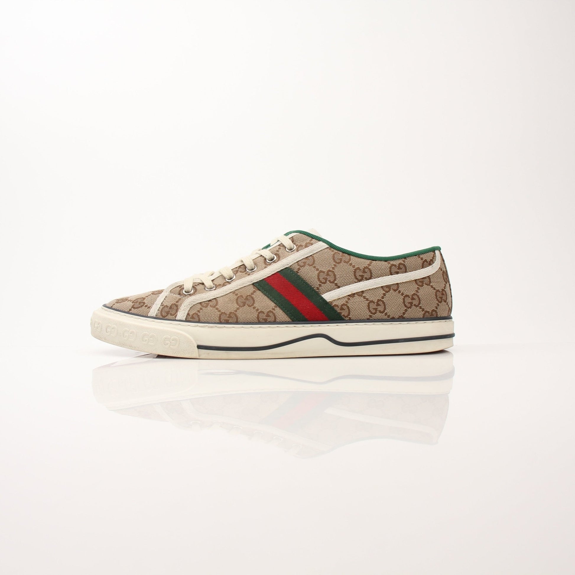Gold & Beyond Gucci men's GG Tennis 1977 low-top sneakers with white leather and signature logo design.