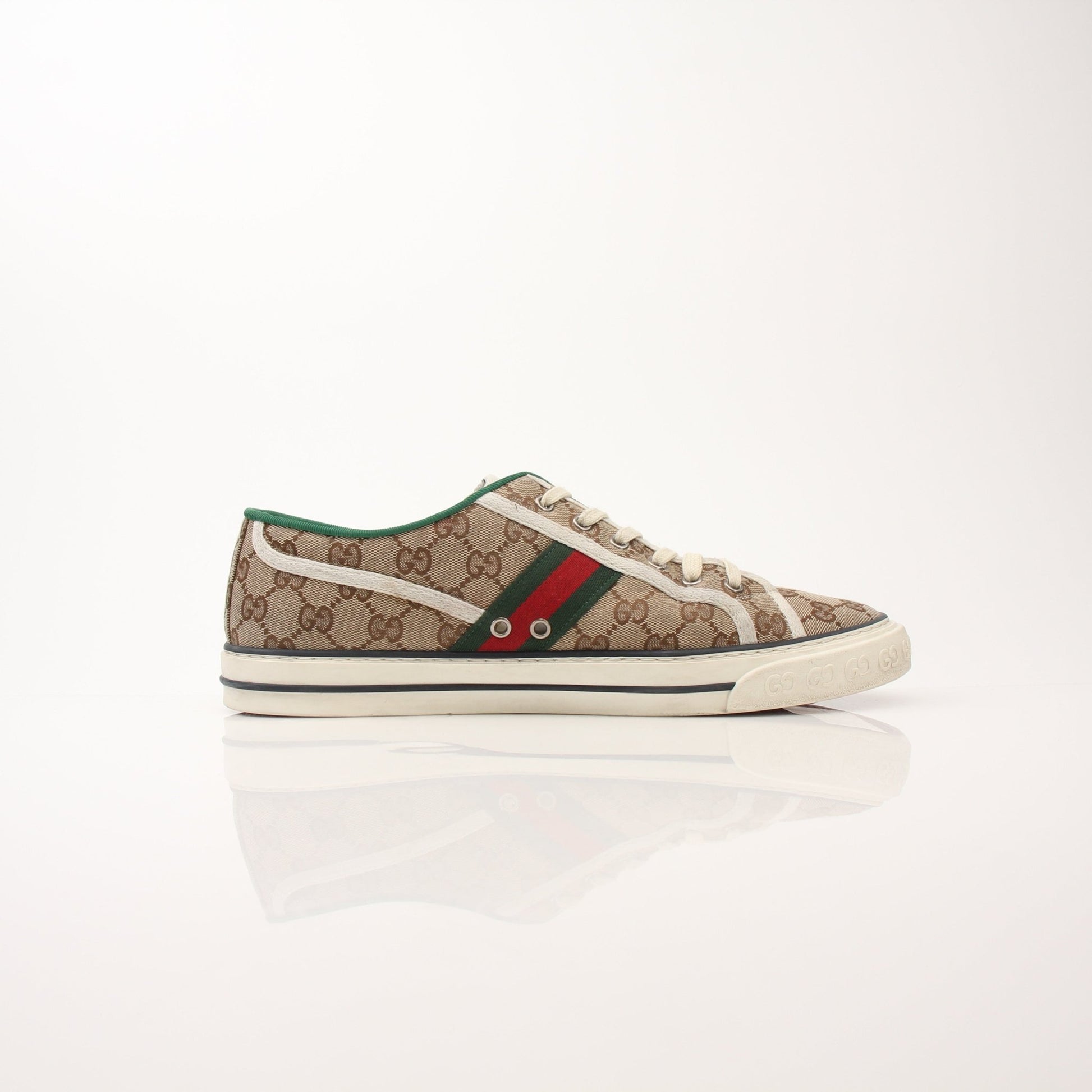 Gold & Beyond men's Gucci GG Tennis 1977 low-top sneakers featuring classic design and stylish details.