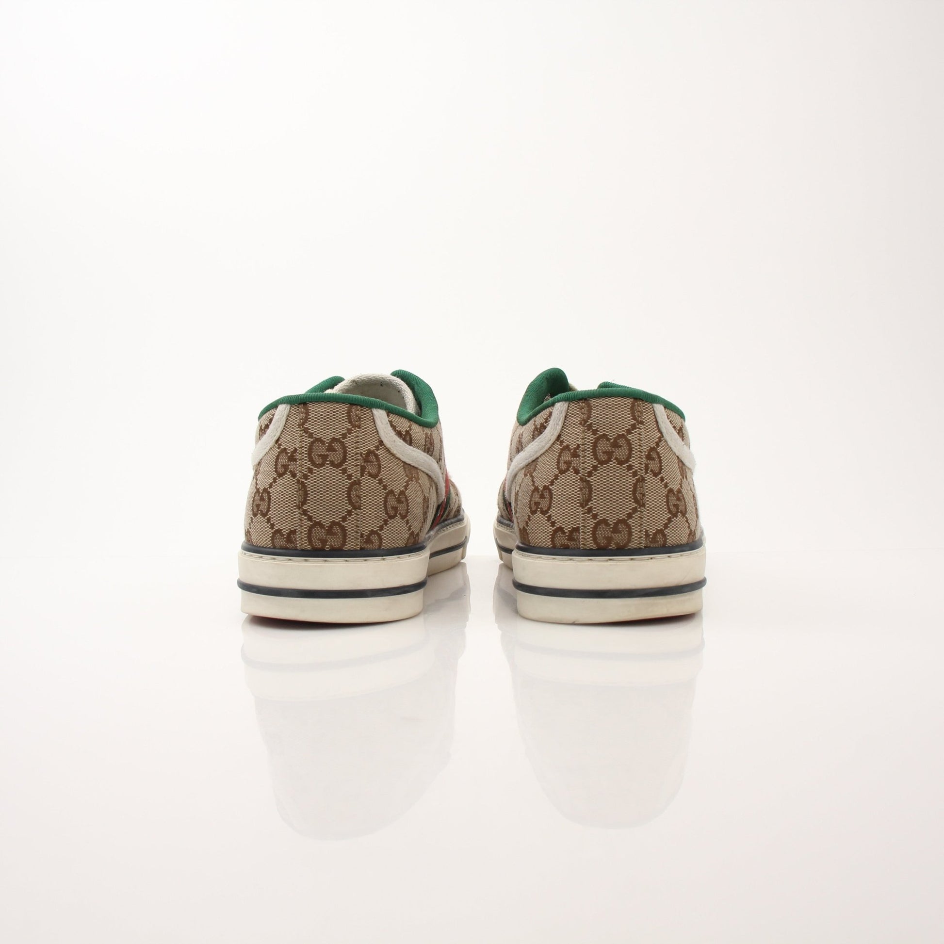 Gold & Beyond men's Gucci GG Tennis 1977 low-top sneakers featuring classic design and stylish leather uppers.