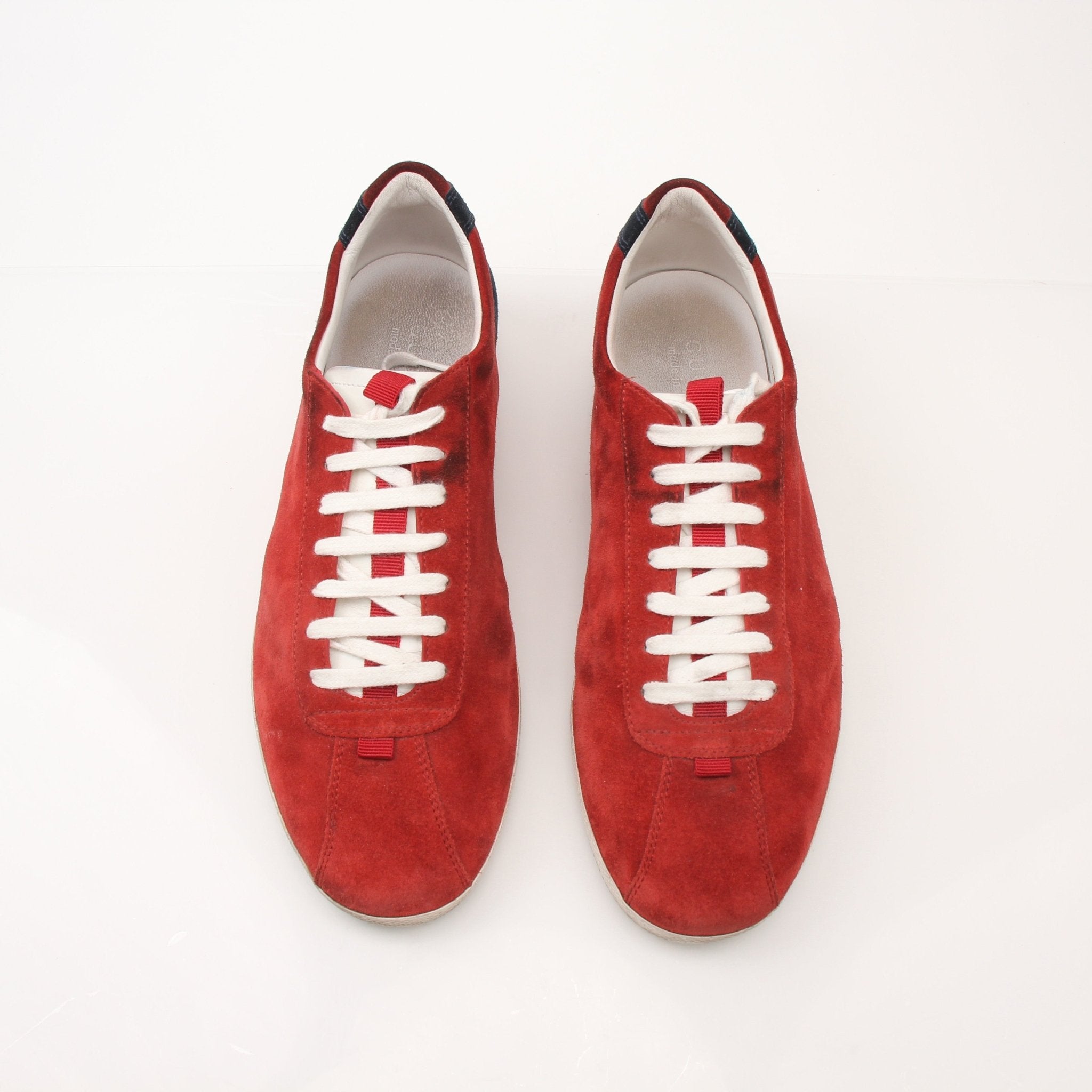 Gold & Beyond Gucci men's Softy Tek sneakers showing white and black athletic shoes with stylish design and laces.