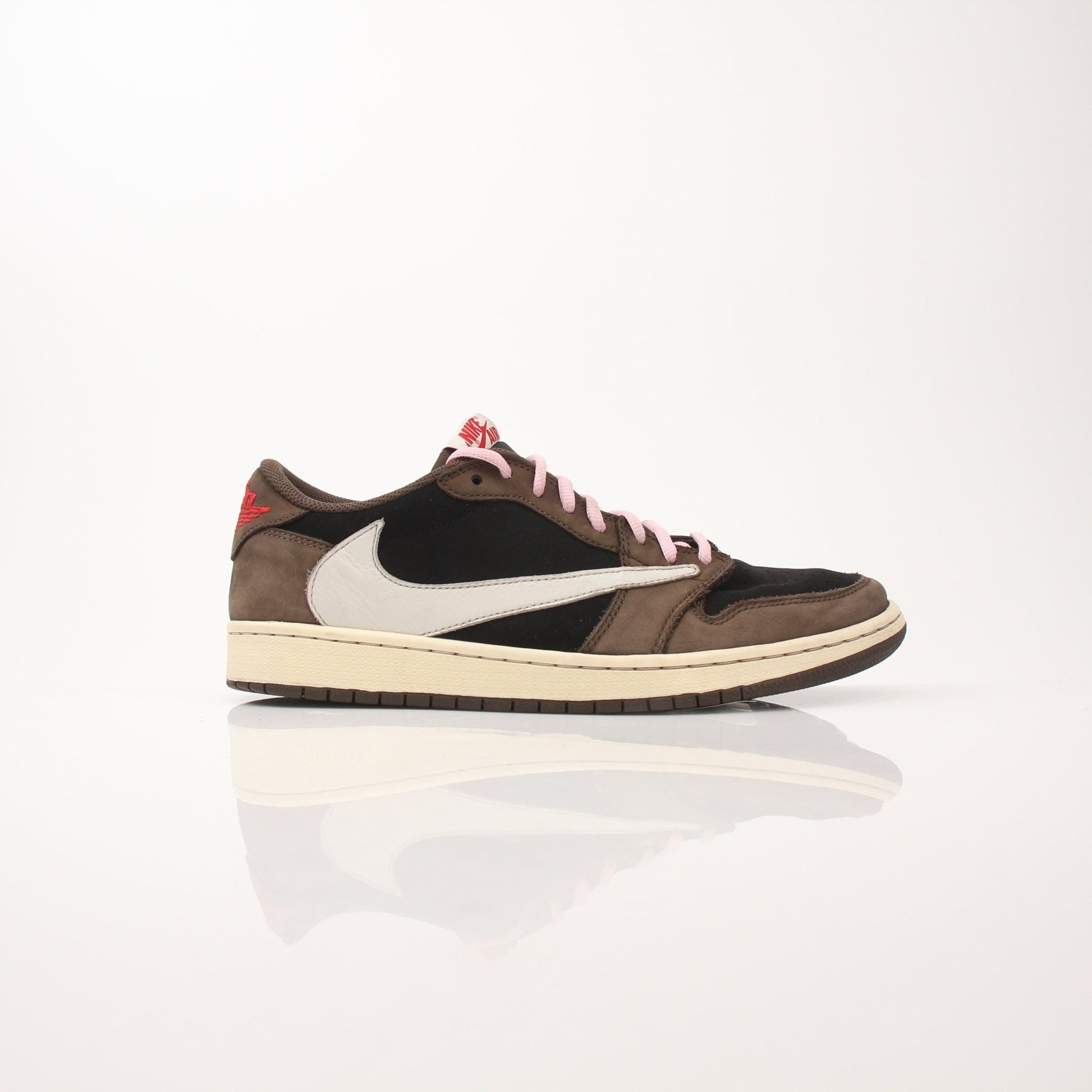 Gold & Beyond Air Jordan X Travis Scott Men's Jordan 1 Low sneakers, stylish black and red shoes with unique design details.