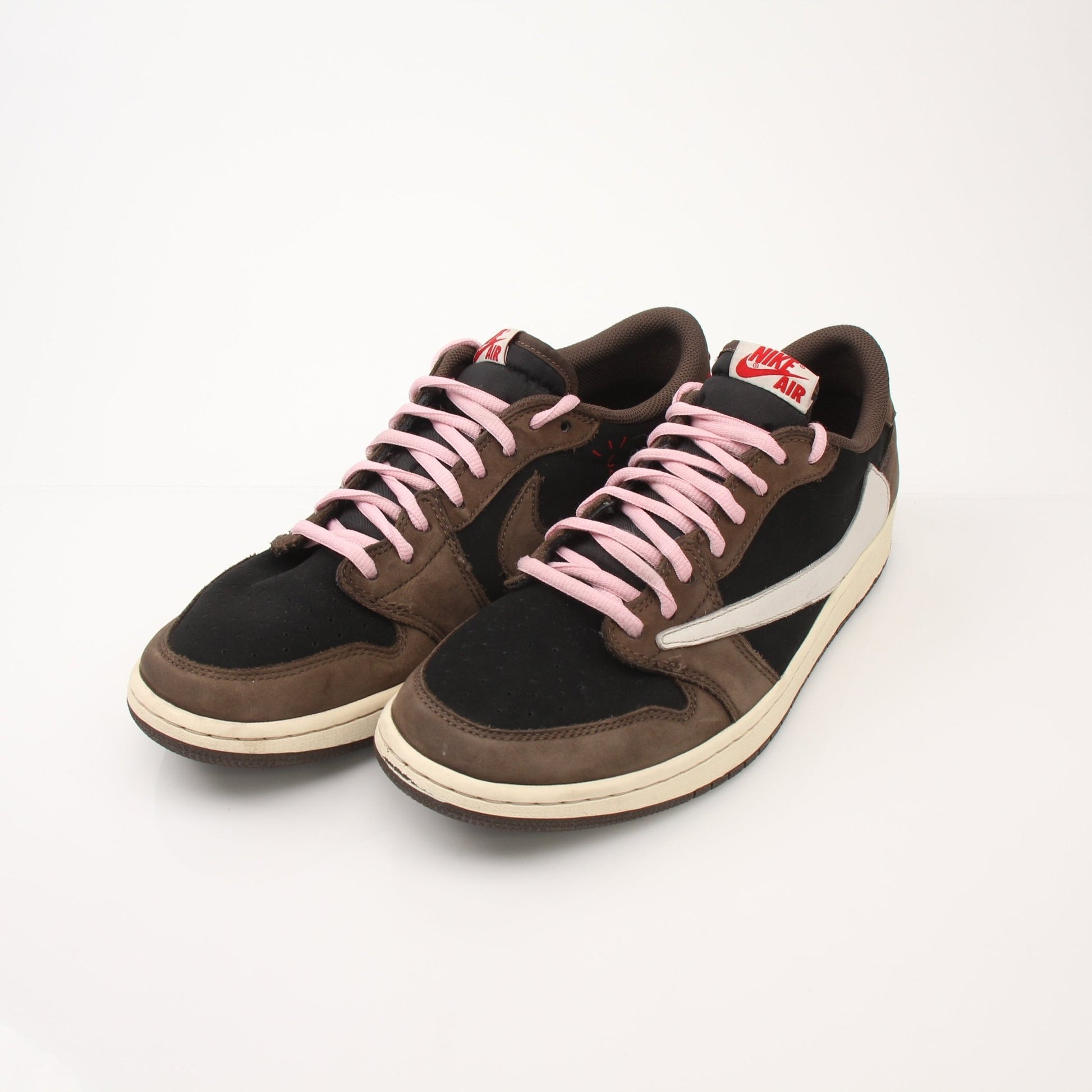 Gold & Beyond Air Jordan X Travis Scott men's Jordan 1 Low sneakers, side view showing black and brown colorway with signature design details.