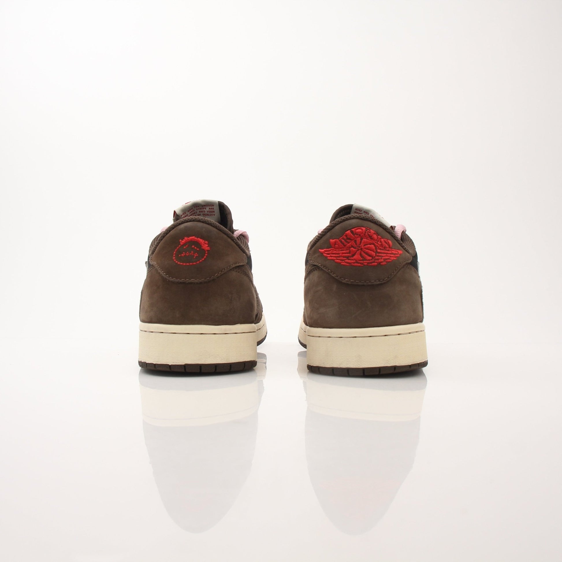 Gold & Beyond Air Jordan X Travis Scott men's Jordan 1 Low sneakers with black and red colorway, showcasing stylish athletic shoes