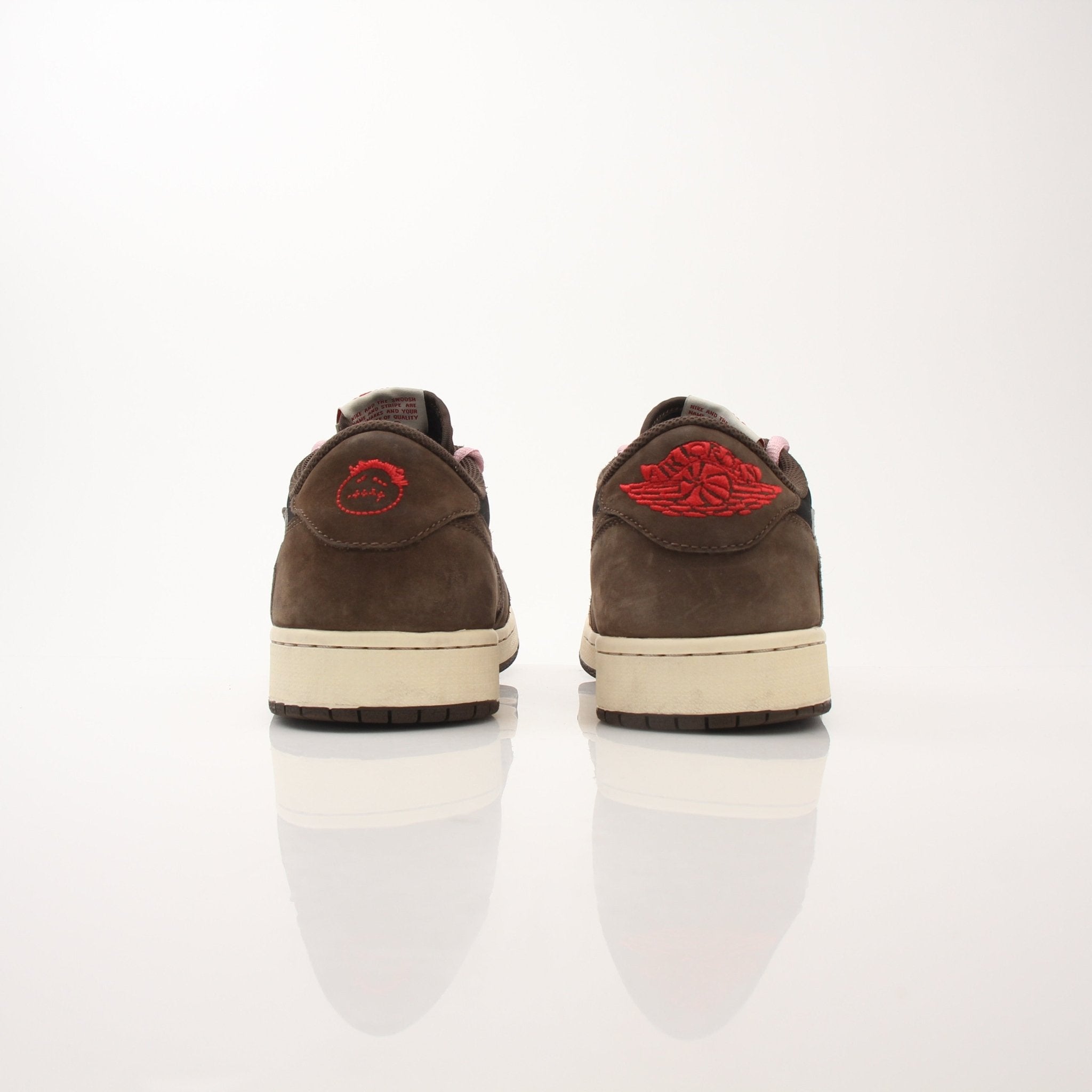 Gold & Beyond Air Jordan X Travis Scott men's Jordan 1 Low sneakers with black and red colorway, showcasing stylish athletic shoes