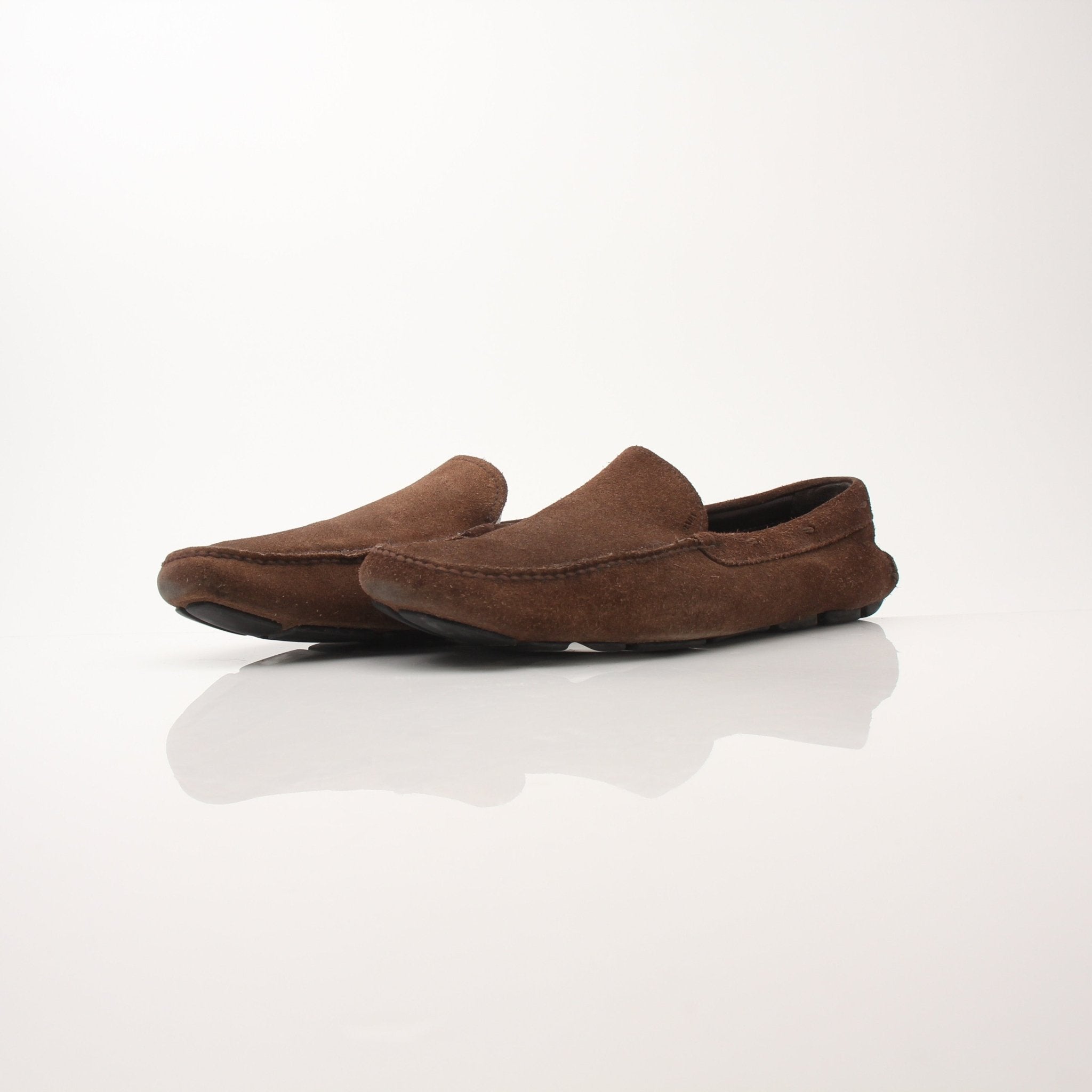 Gold & Beyond Prada men's driving suede loafers, stylish slip-on shoes with sleek design and comfortable fit.
