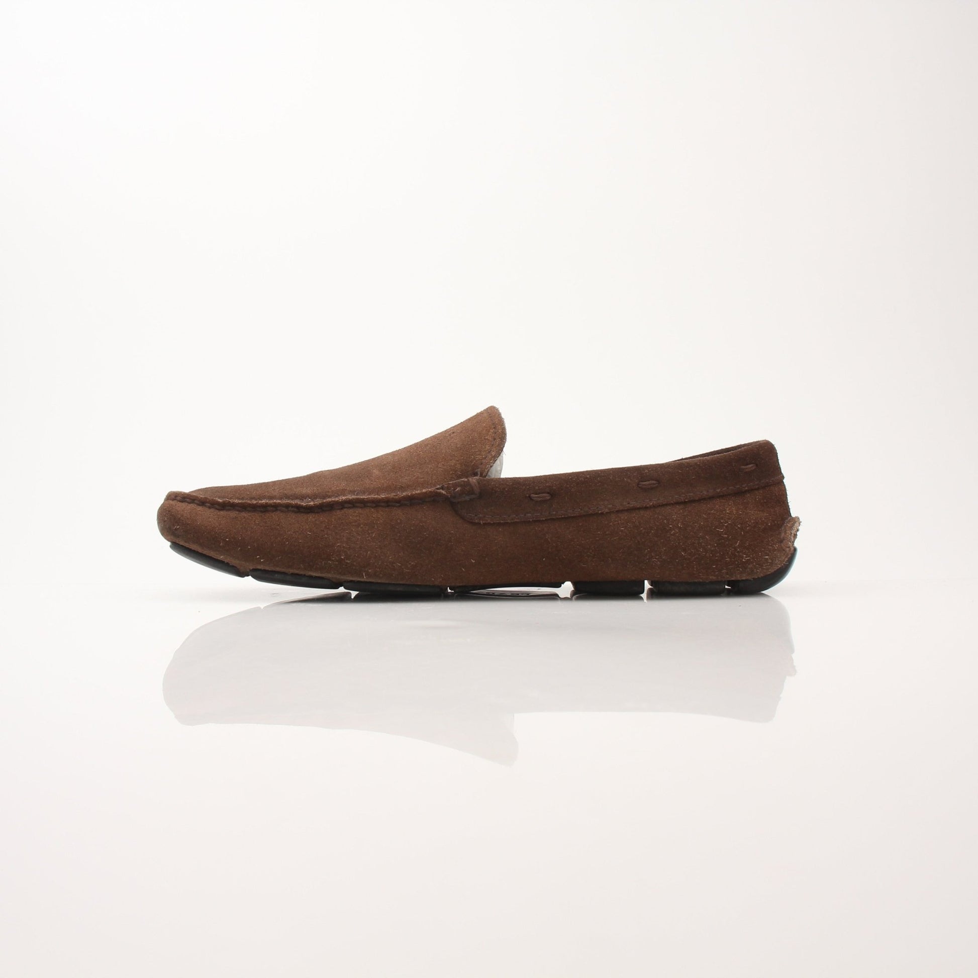 Gold & Beyond Prada men's driving suede loafers, stylish shoes with sleek design and classic detailing, perfect for casual or formal wear.