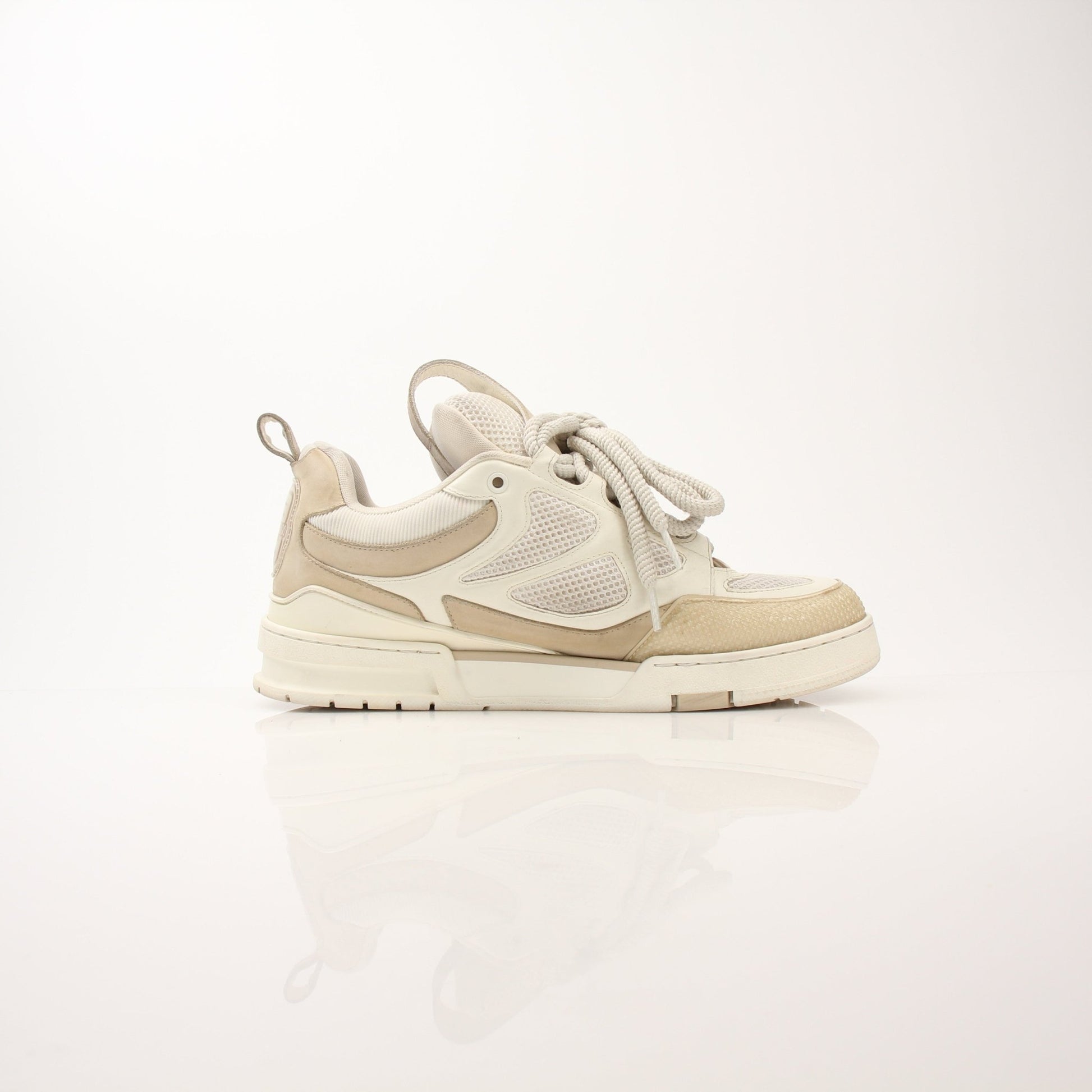 Louis Vuitton men's LV skate sneakers by Gold & Beyond, stylish black shoes with white accents and logo details.