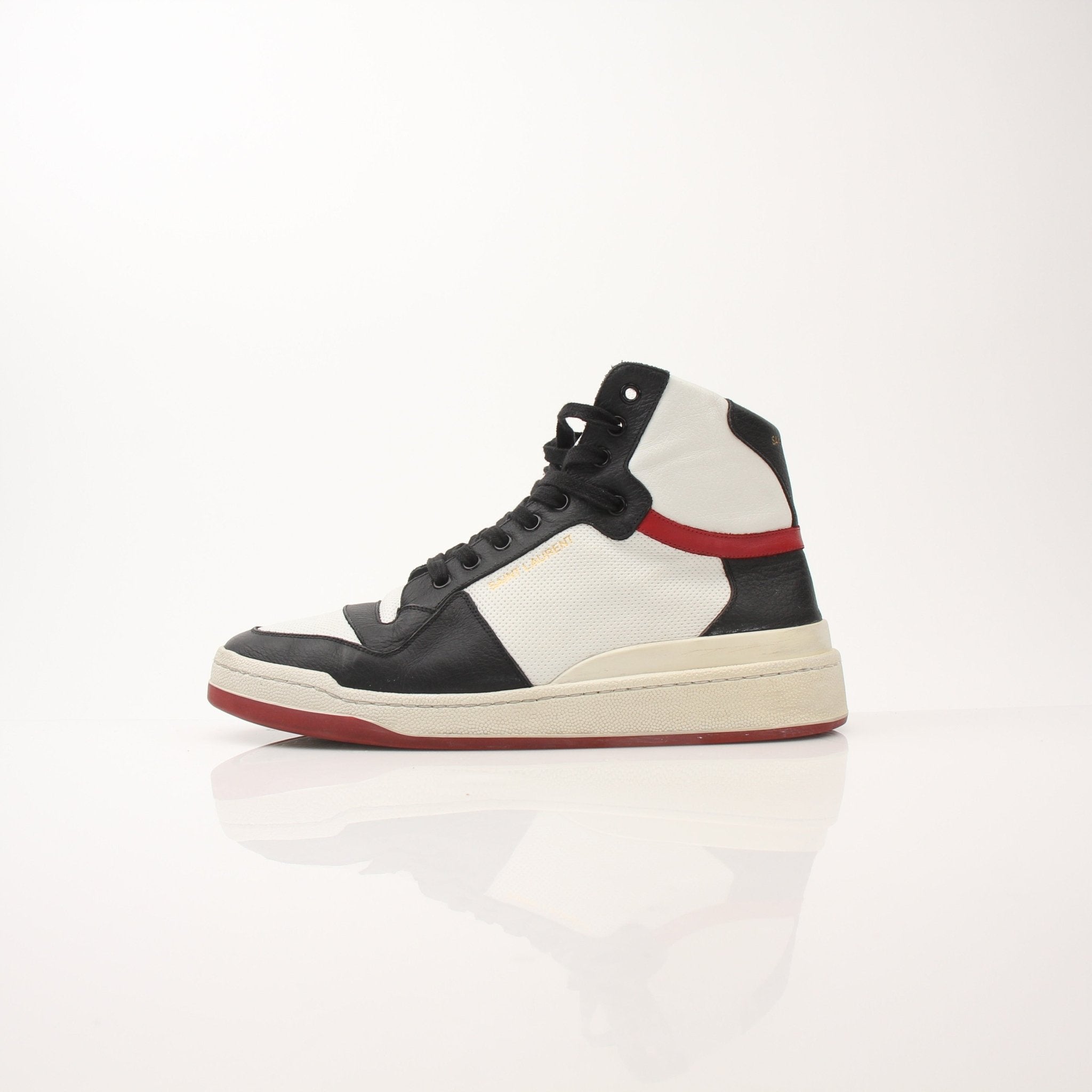 Gold & Beyond Saint Laurent Men's SL-24 leather sneakers with sleek design, white laces, and stylish black uppers.