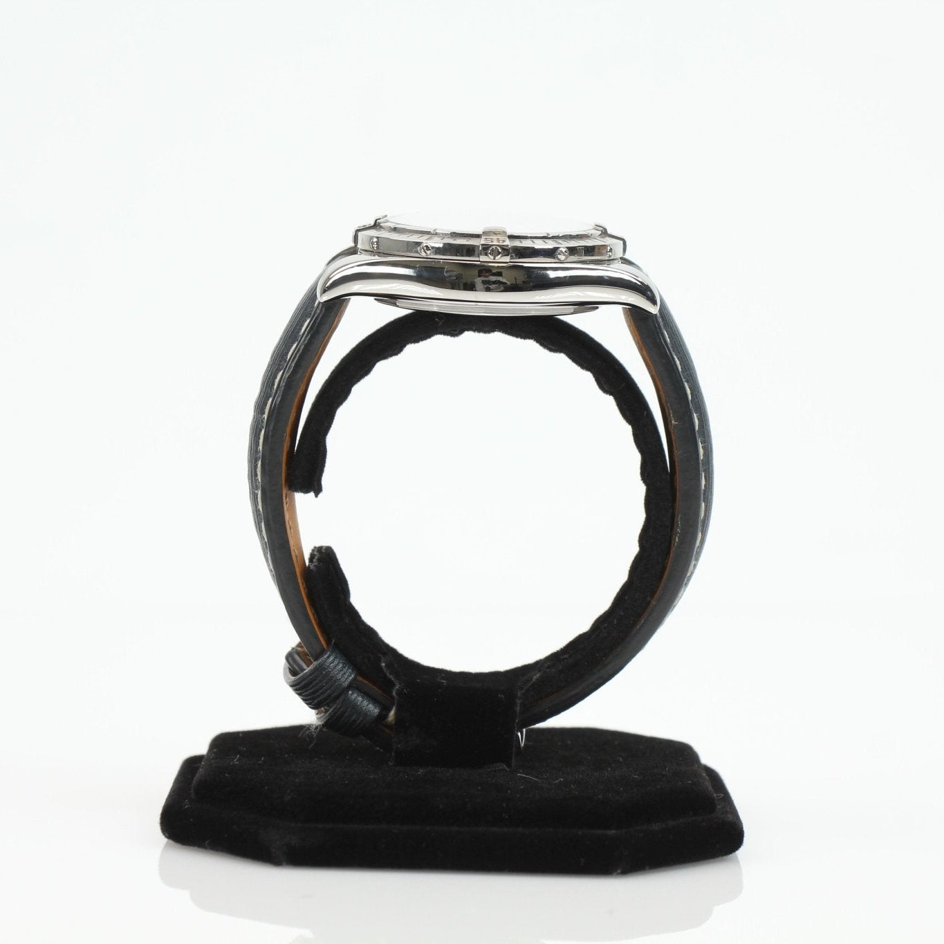 Close-up of a Breitling Galactic 41 luxury watch with stainless steel case and black dial, displayed on a background.