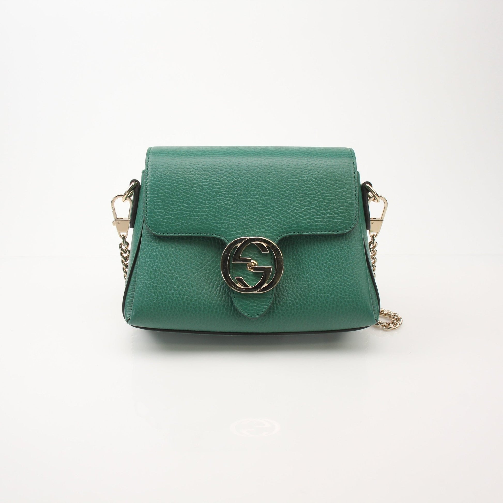 Gold & Beyond Gucci Dollar Calfskin Interlocking G crossbody handbag with sleek design and adjustable strap, featuring signature logo details.