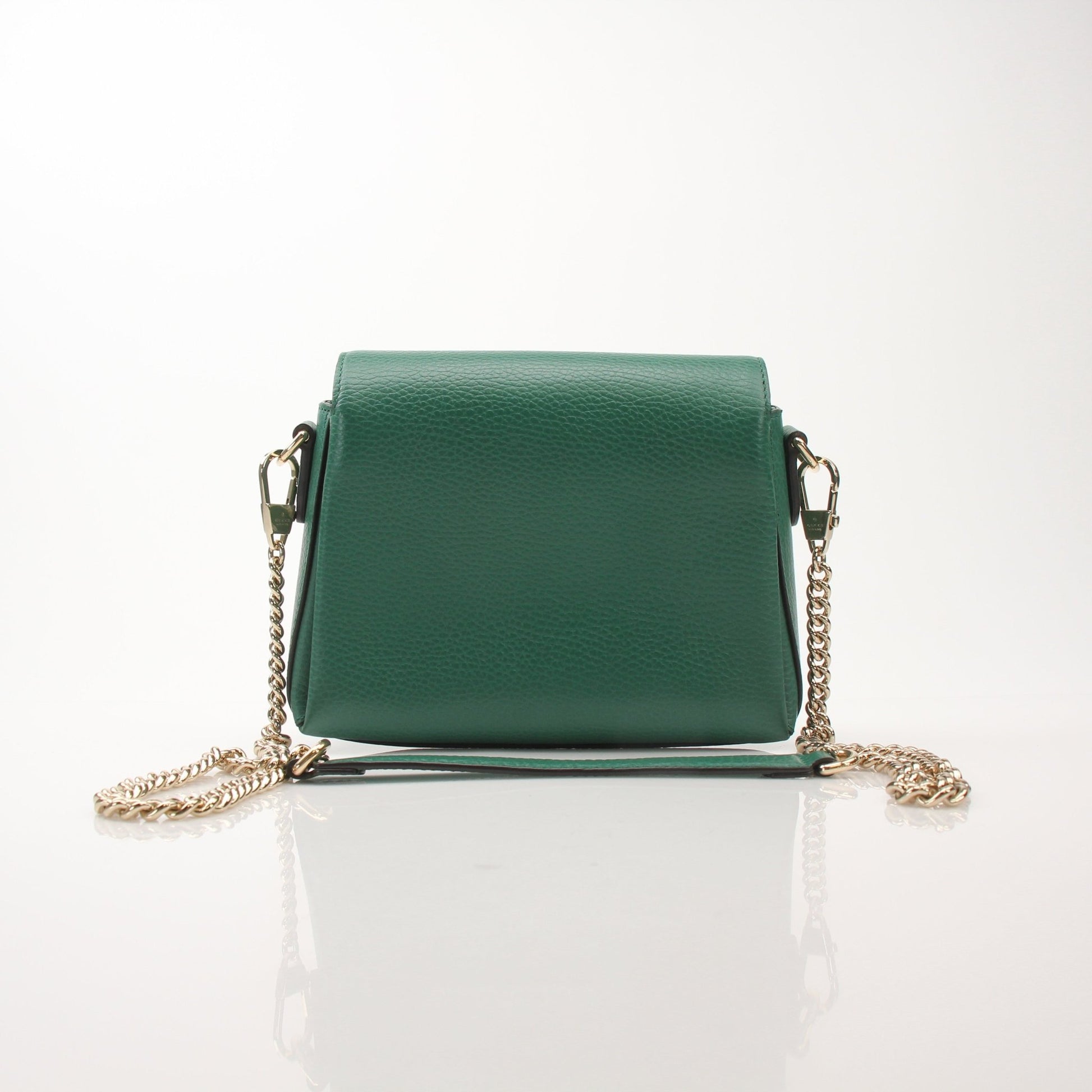 Gucci Dollar calfskin interlocking G crossbody handbag with gold hardware and adjustable strap, detailed leather craftsmanship.