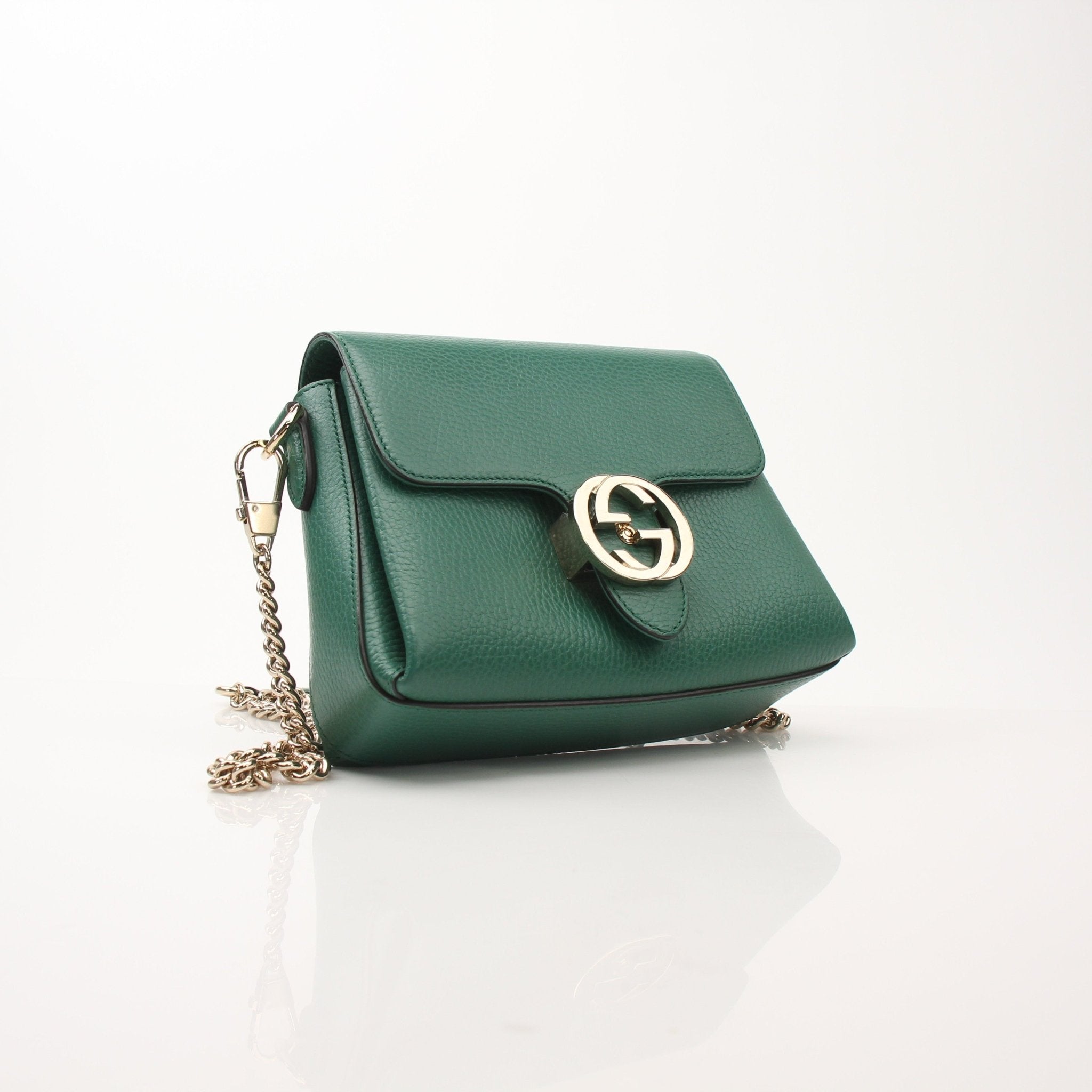 Gucci Dollar Calfskin Interlocking G crossbody handbag with gold hardware and adjustable strap, stylish and compact designer bag.
