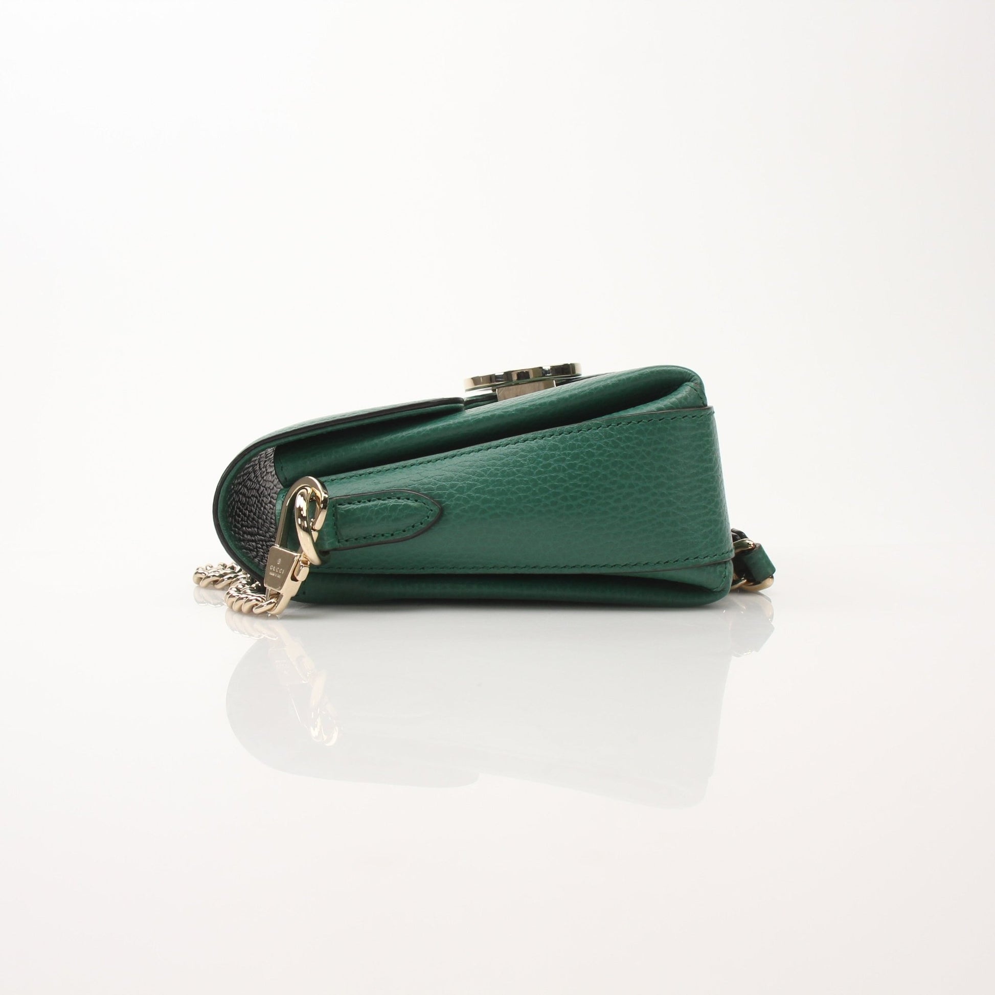 Gucci Dollar Calfskin Interlocking G crossbody handbag with gold hardware and adjustable strap, shown on a white background.