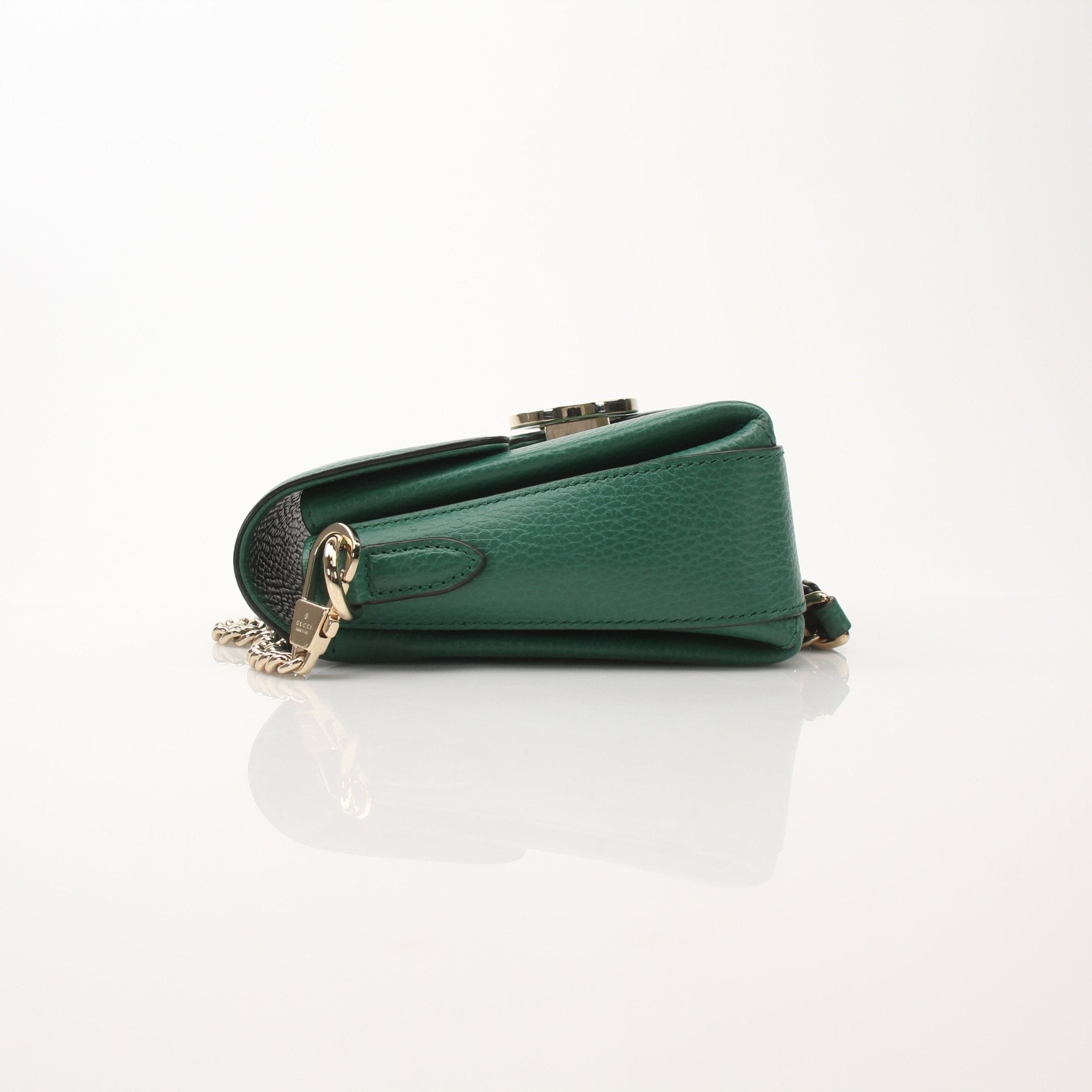 Gucci Dollar Calfskin Interlocking G crossbody handbag with gold hardware and adjustable strap, shown on a white background.