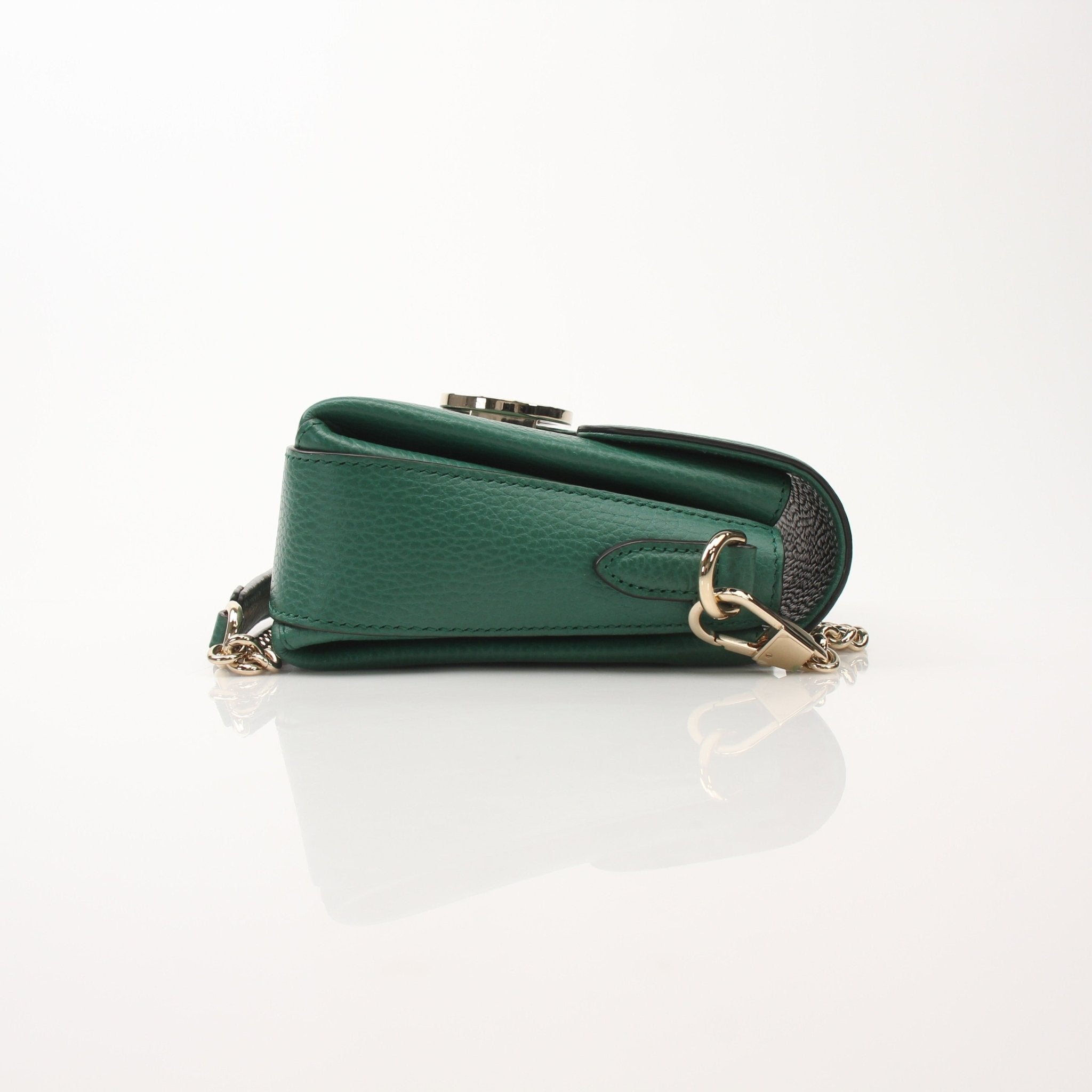 Gucci Dollar Calfskin Interlocking G crossbody handbag with gold hardware, black leather strap, and signature GG logo.