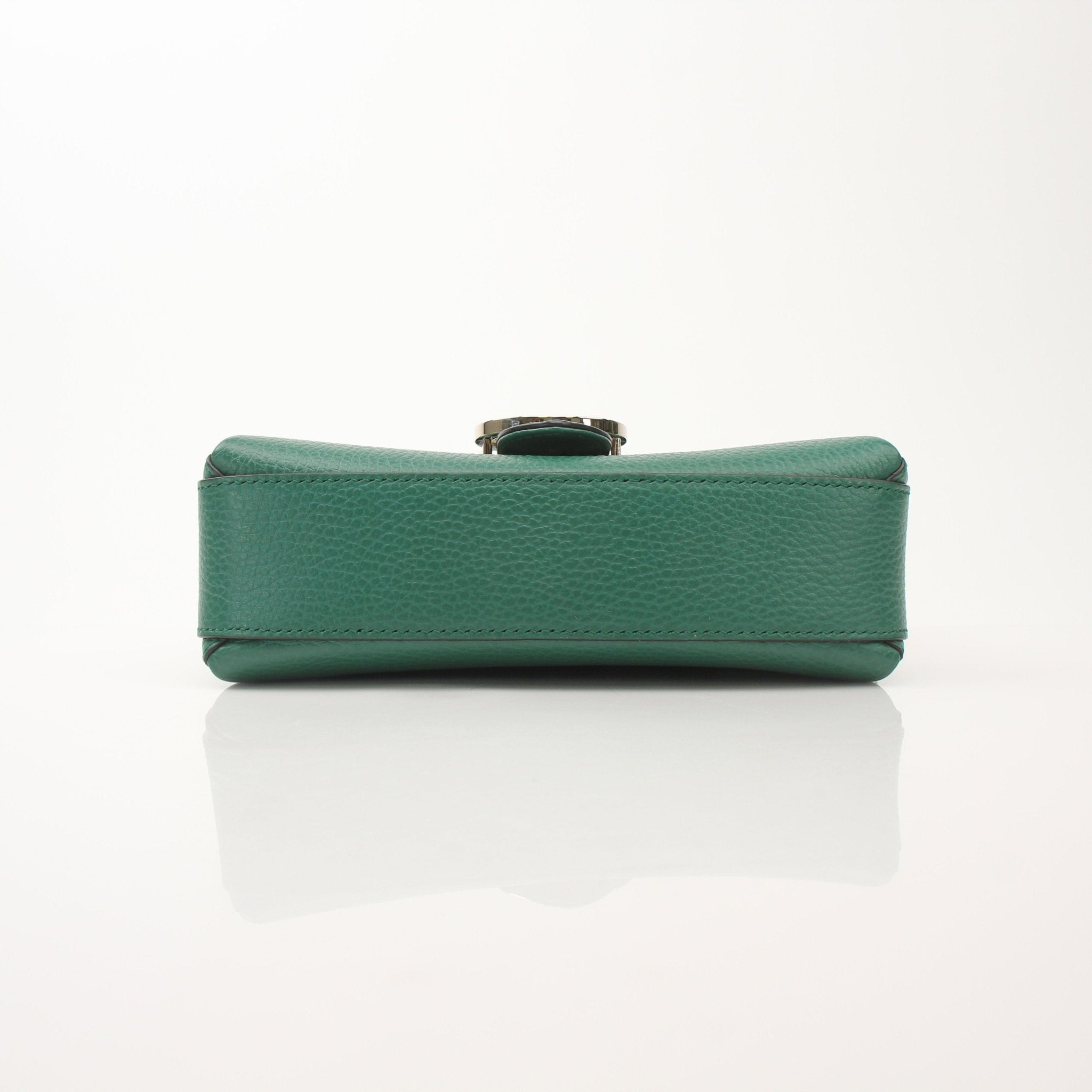 Gold & Beyond Gucci Dollar Calfskin Interlocking G crossbody handbag with gold hardware and adjustable strap.