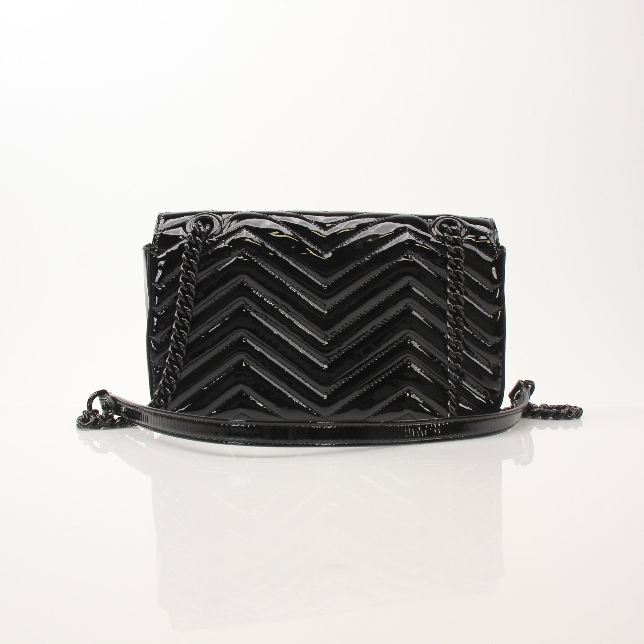 Gucci GG Marmont black matelassé shoulder handbag with chevron pattern and gold hardware, stylish and elegant for everyday use