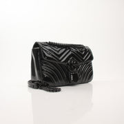 Gucci GG Marmont black matelassé shoulder handbag with chain strap and gold-toned hardware, stylish and luxurious accessory.
