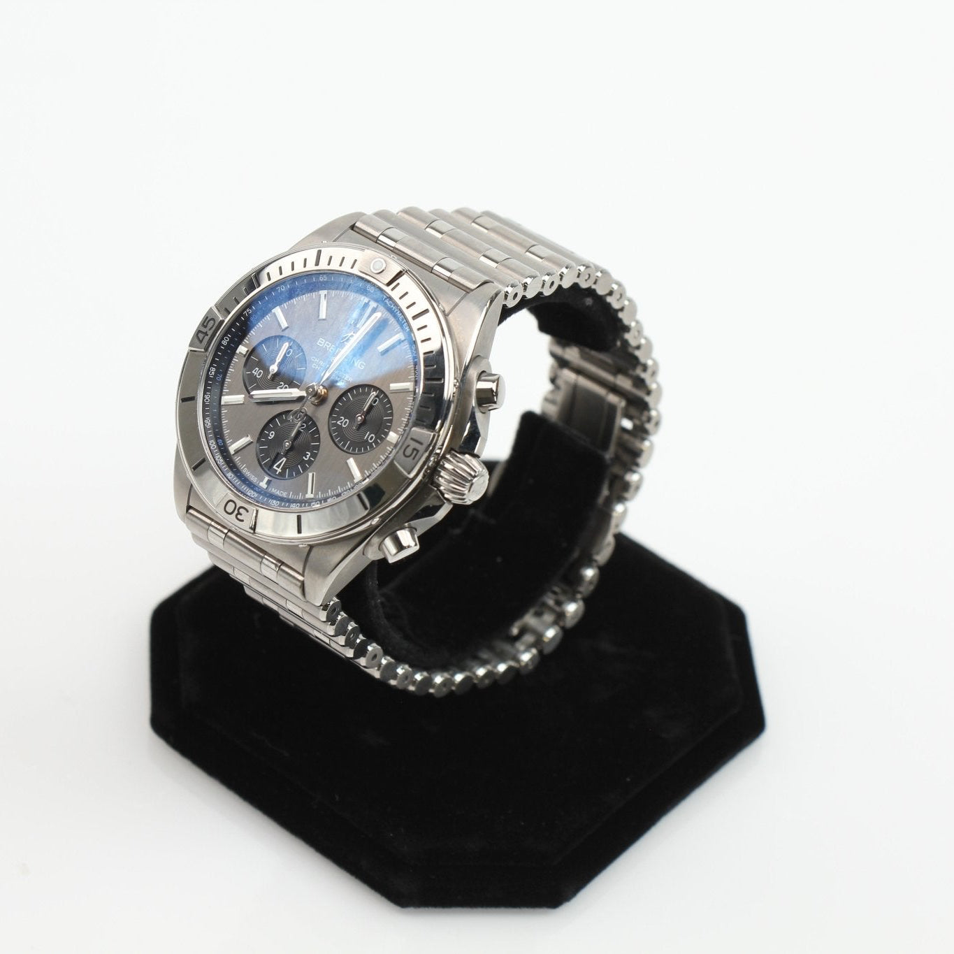 Titanium Breitling Chronomat B01 wristwatch with black dial and stainless steel bracelet, showcasing luxury and precision craftsmanship.